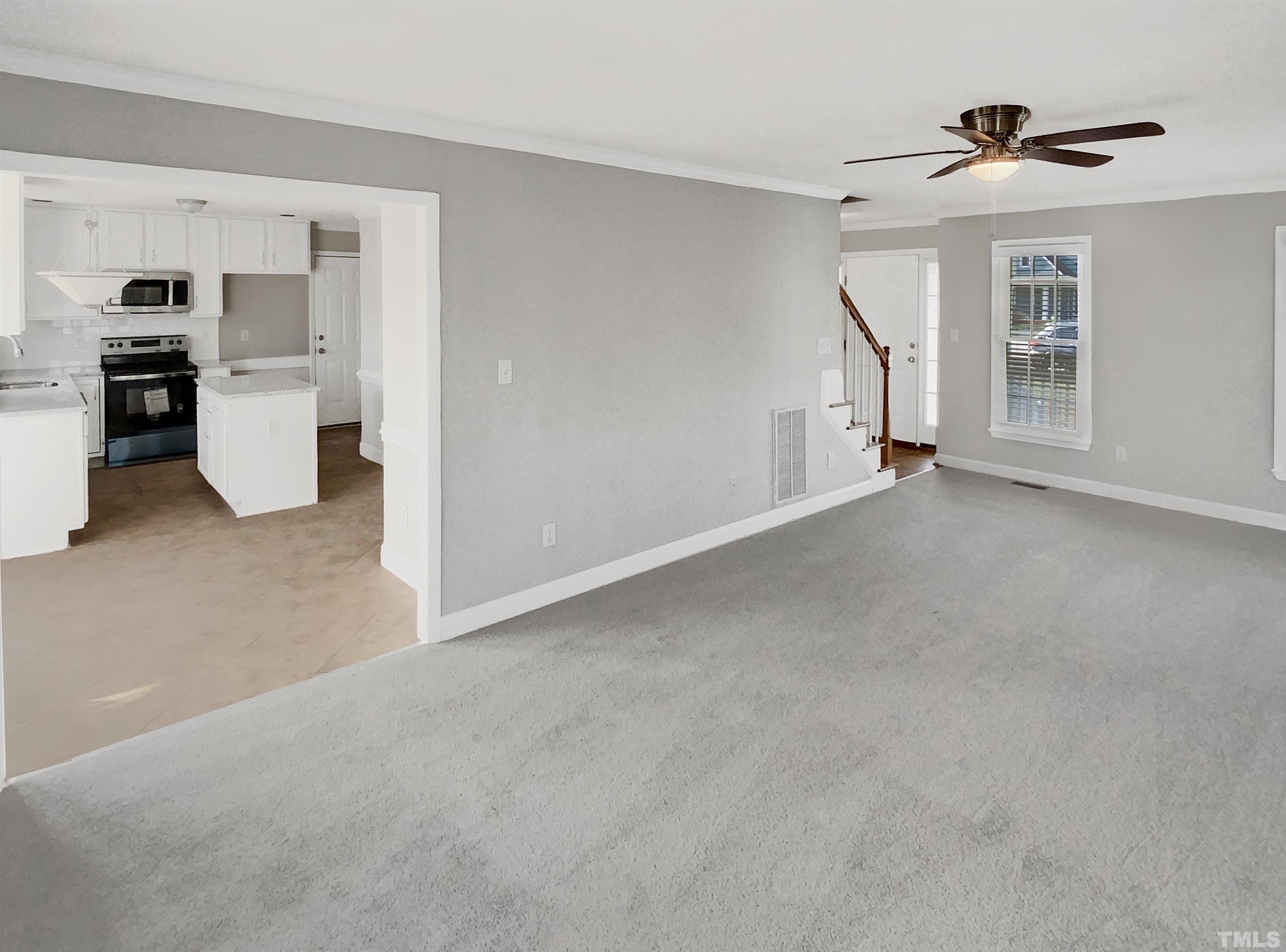 3216 Leebrook Road Raleigh, NC 27616 - Photo 5 of 17 a view of empty room with a kitchen