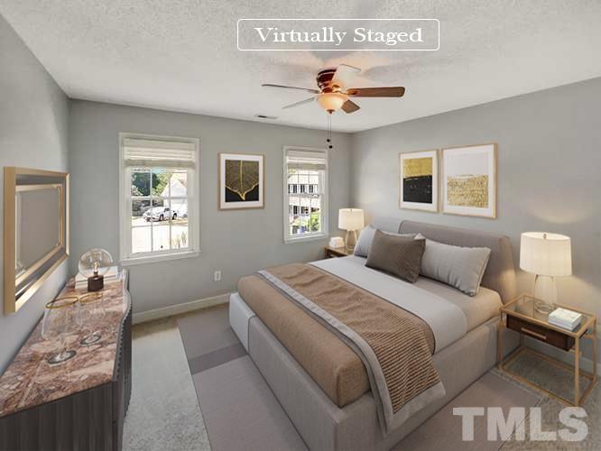 3216 Leebrook Road Raleigh, NC 27616 - Photo 8 of 17 a bedroom with a large bed and a window