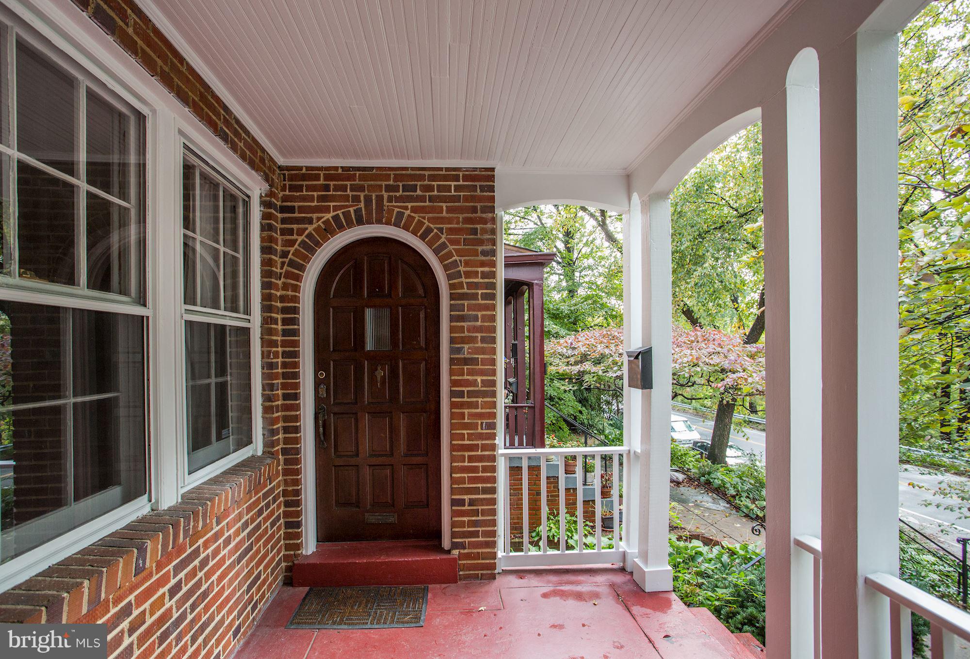 3147 Adams Mill Road Northwest Washington, DC 20010 - Photo 8 of 36 Large front porch overlooking tree-lined street