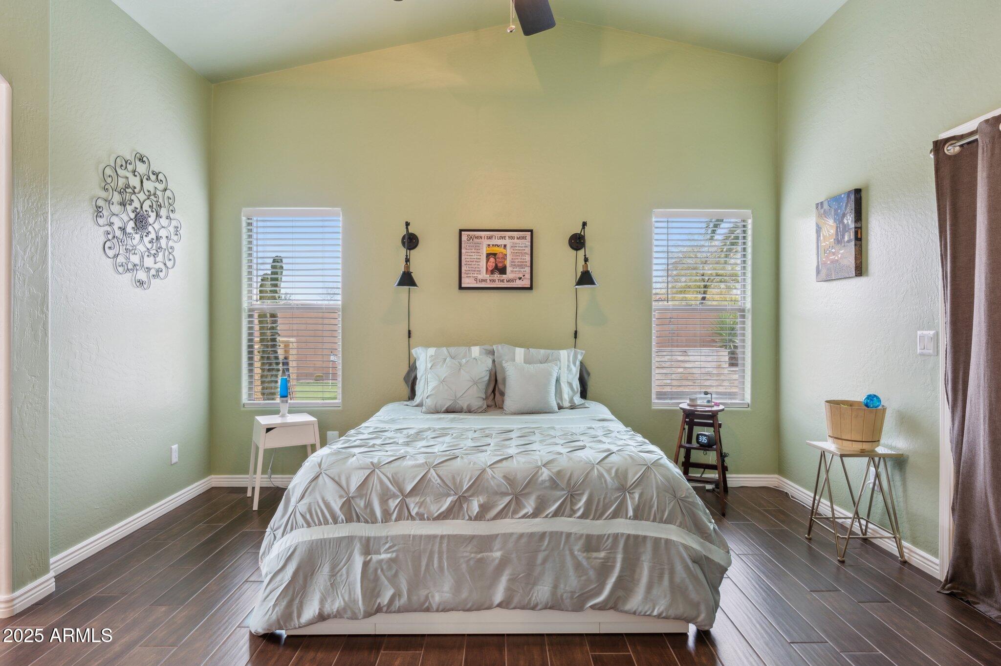 411 West Gascon Road San Tan Valley, AZ 85143 - Photo 13 of 30 a bedroom with a bed and wooden floor