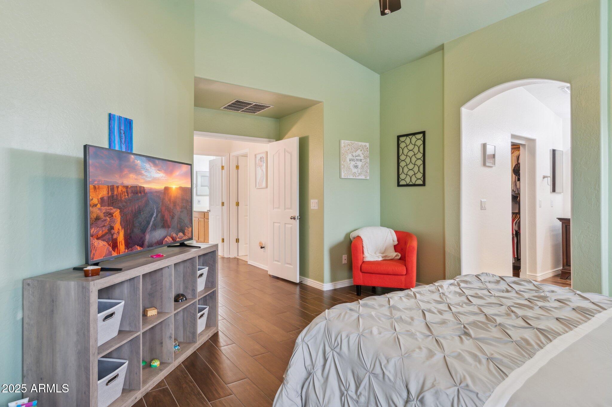 411 West Gascon Road San Tan Valley, AZ 85143 - Photo 14 of 30 a bedroom with a bed and a flat screen tv