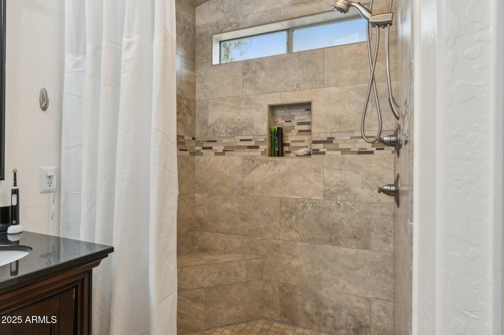 411 West Gascon Road San Tan Valley, AZ 85143 - Photo 16 of 30 a bathroom with a granite countertop shower