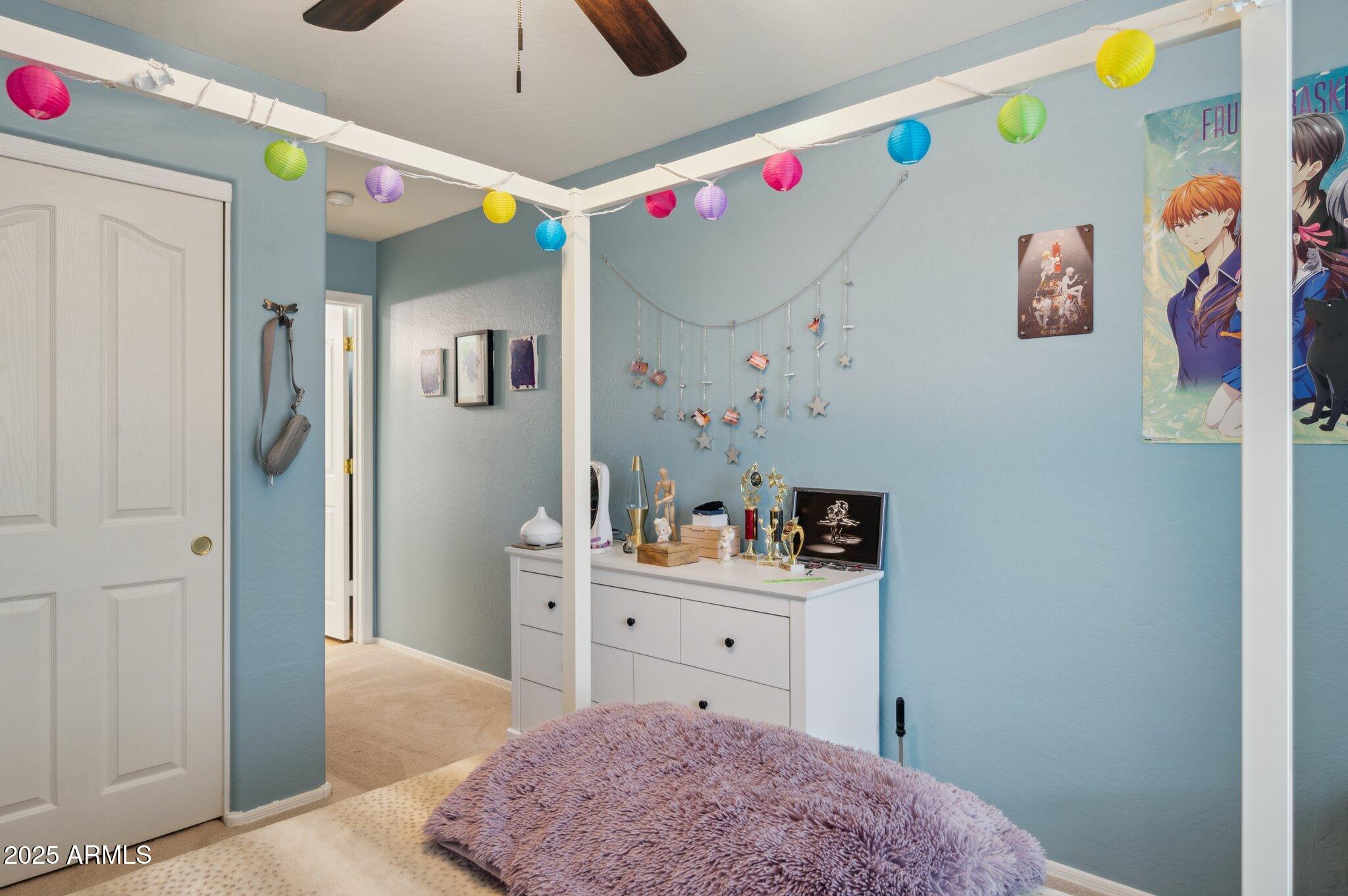 411 West Gascon Road San Tan Valley, AZ 85143 - Photo 18 of 30 a room that has a bed and a dresser in it