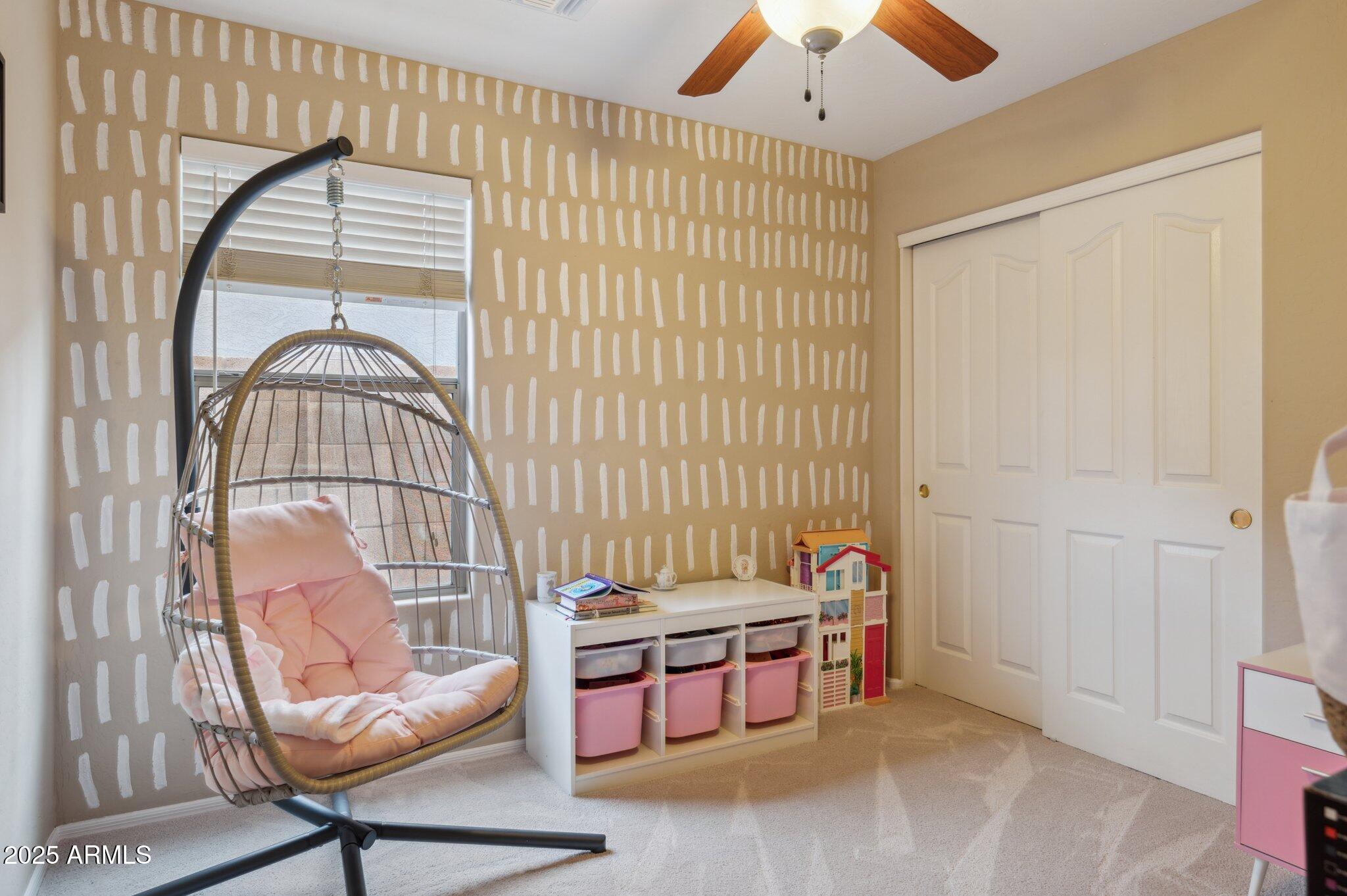 411 West Gascon Road San Tan Valley, AZ 85143 - Photo 23 of 30 a living room with furniture a rug and a window