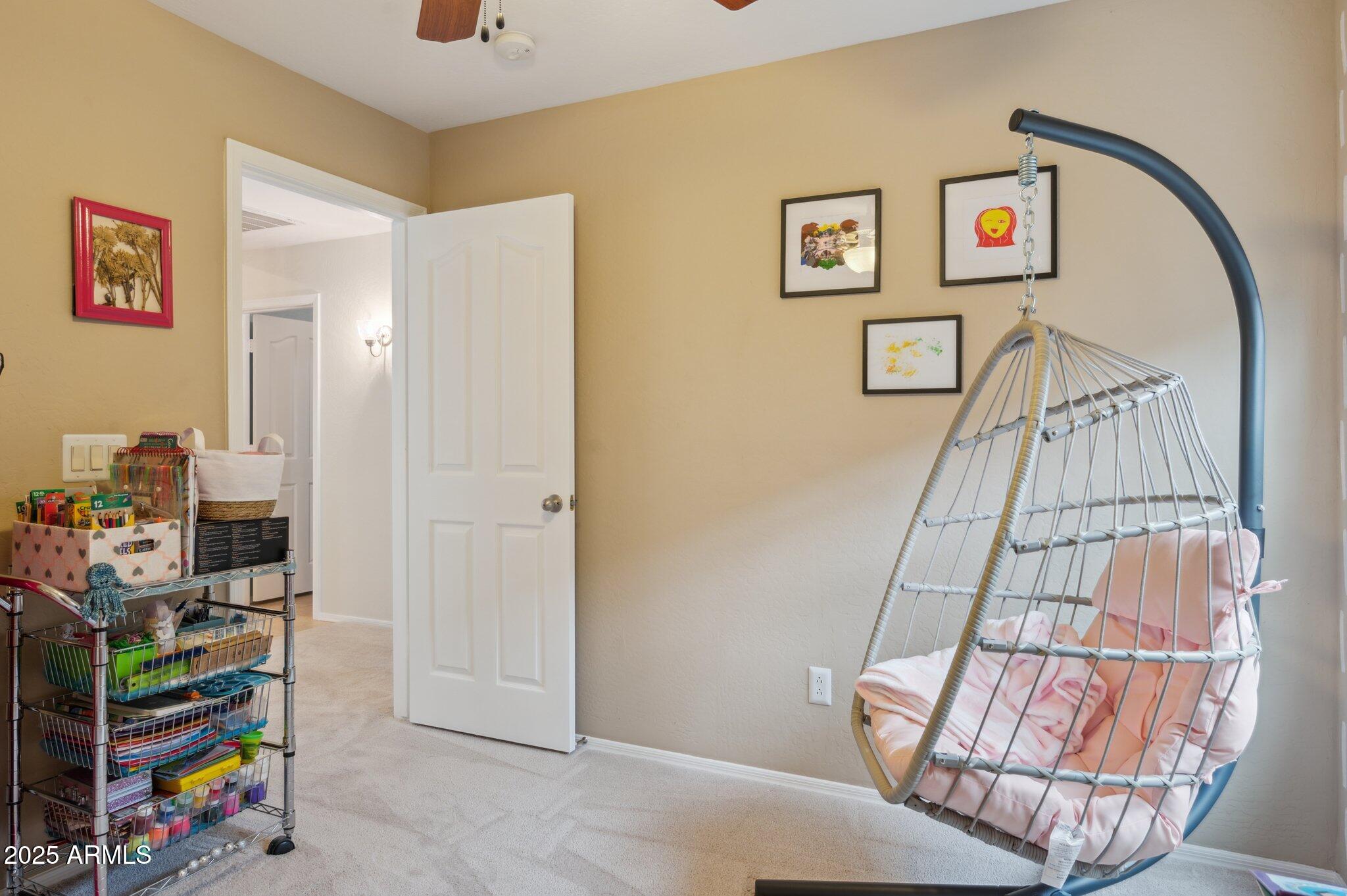 411 West Gascon Road San Tan Valley, AZ 85143 - Photo 24 of 30 a living room with furniture and a couch