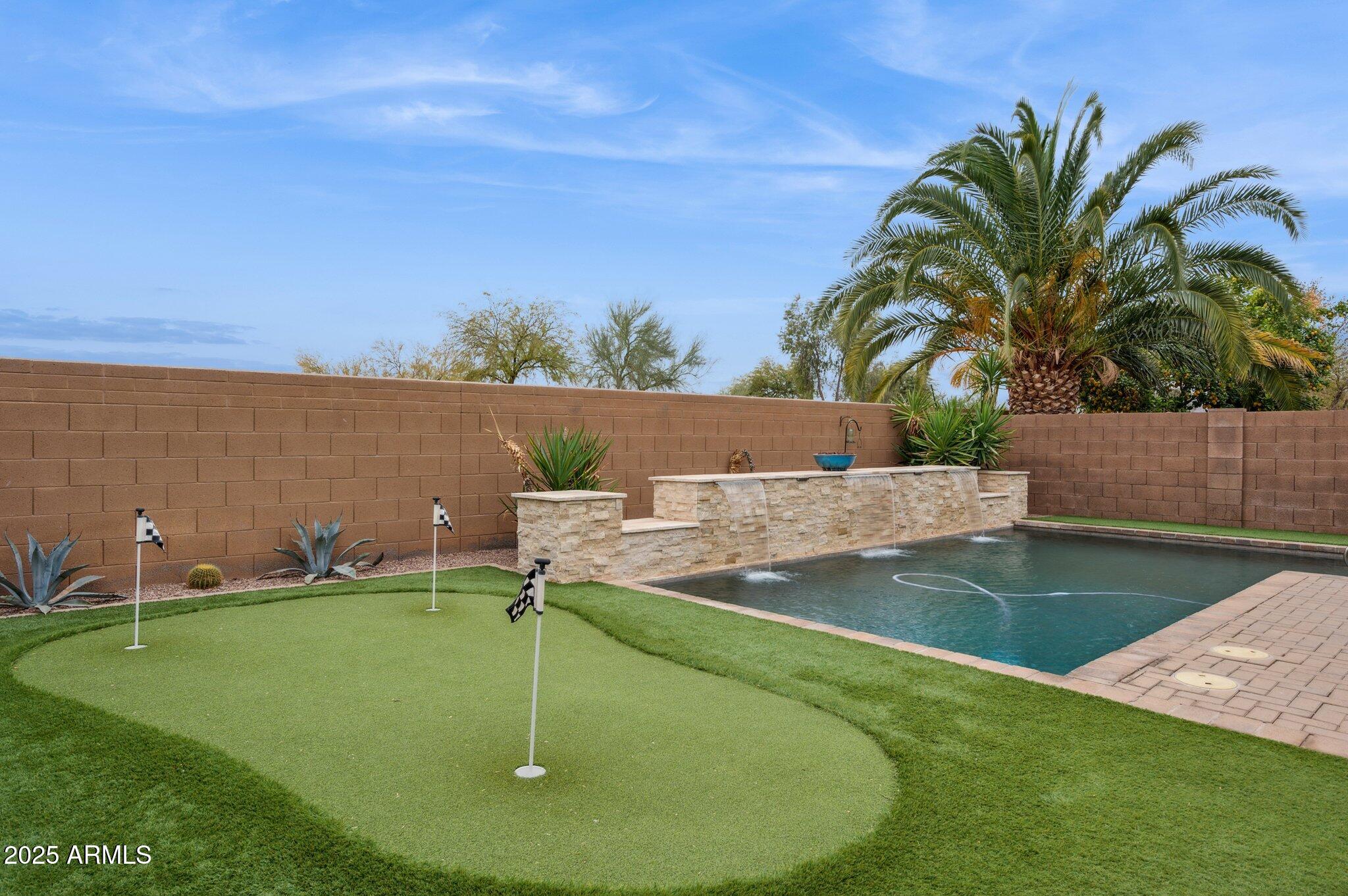 411 West Gascon Road San Tan Valley, AZ 85143 - Photo 29 of 30 a view of a backyard with swimming pool