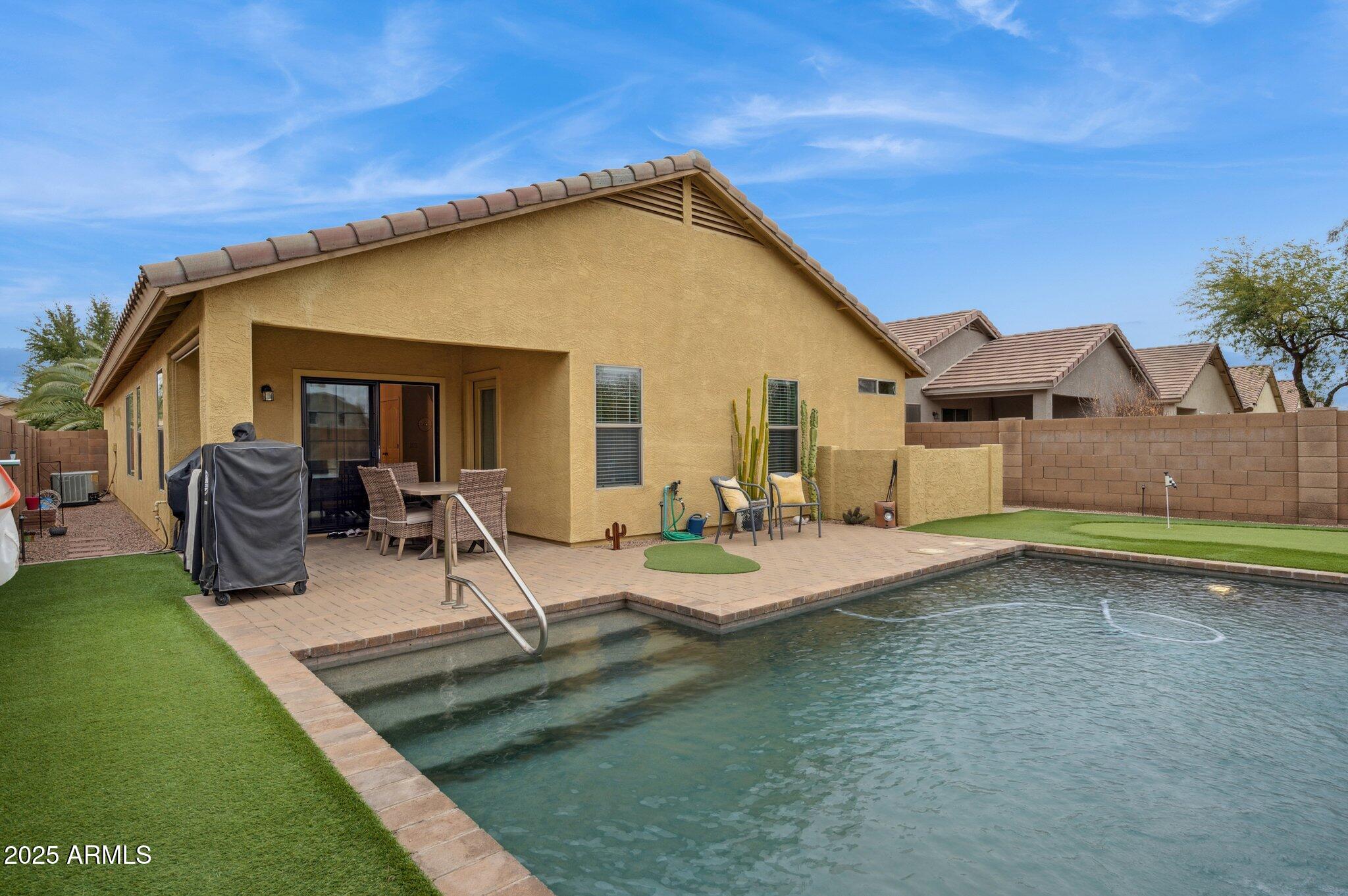 411 West Gascon Road San Tan Valley, AZ 85143 - Photo 30 of 30 a view of a house with backyard porch and sitting area
