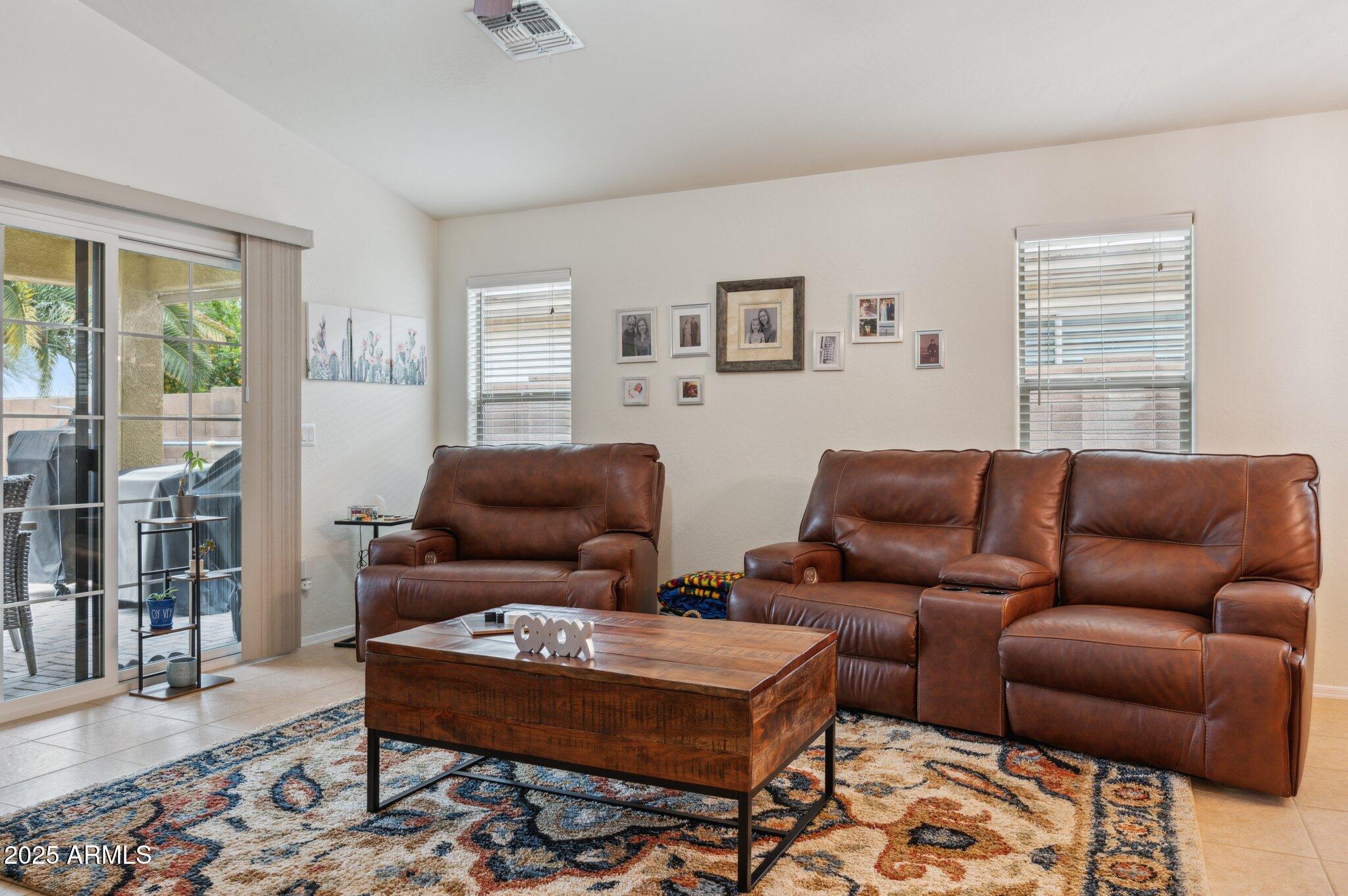 411 West Gascon Road San Tan Valley, AZ 85143 - Photo 9 of 30 a living room with furniture and a window