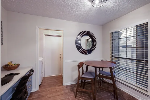 a view of a livingroom with furniture and a window