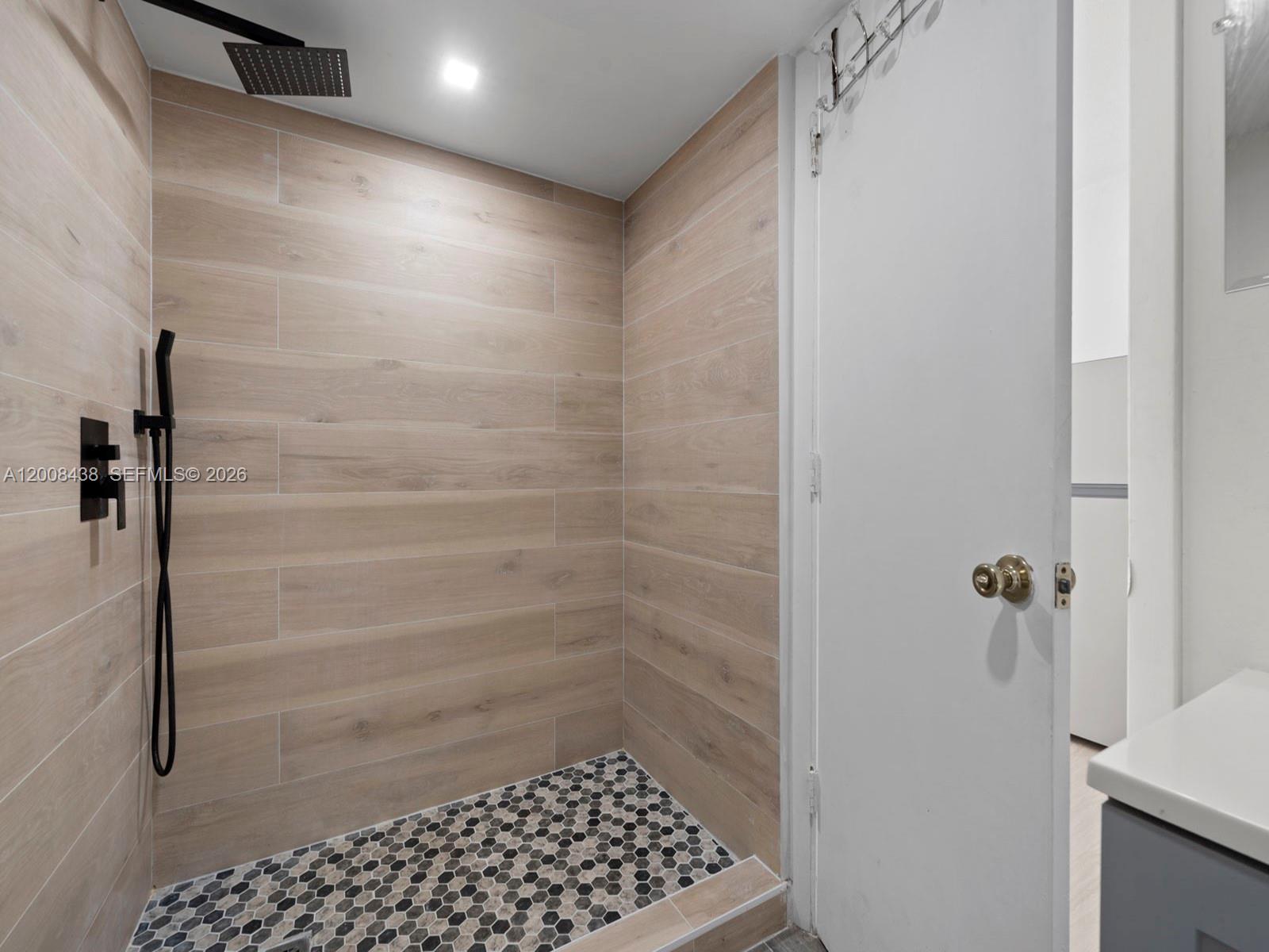 252 East 36th Street, Unit A Hialeah, FL 33013 - Photo 3 of 10 a bathroom with a shower