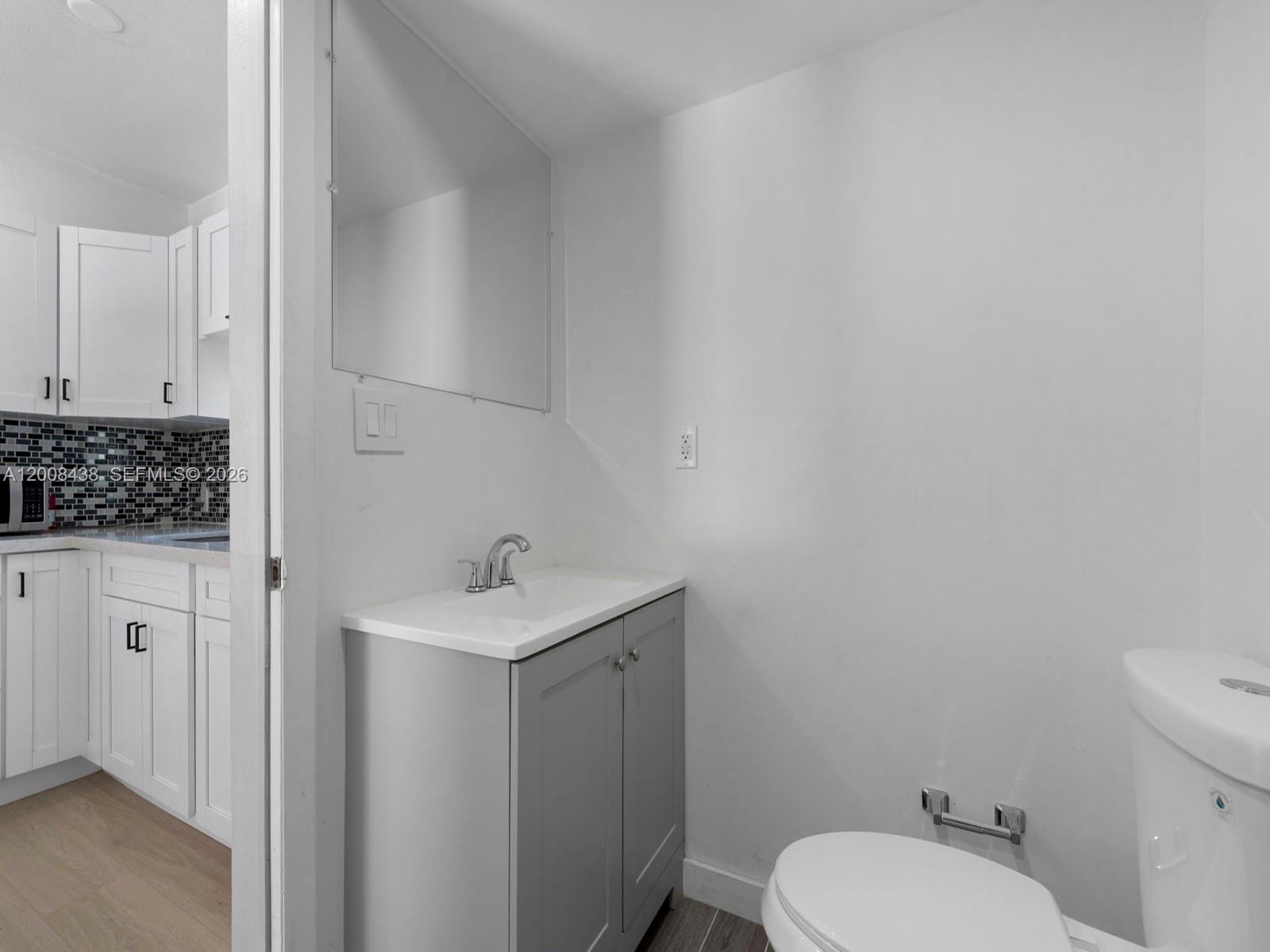 252 East 36th Street, Unit A Hialeah, FL 33013 - Photo 4 of 10 a bathroom with a sink toilet and vanity
