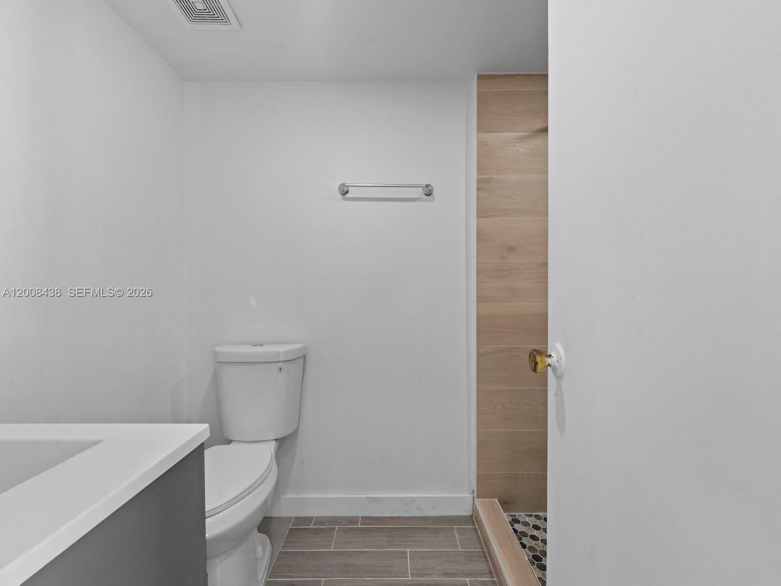 252 East 36th Street, Unit A Hialeah, FL 33013 - Photo 5 of 10 a bathroom with a sink a toilet and shower