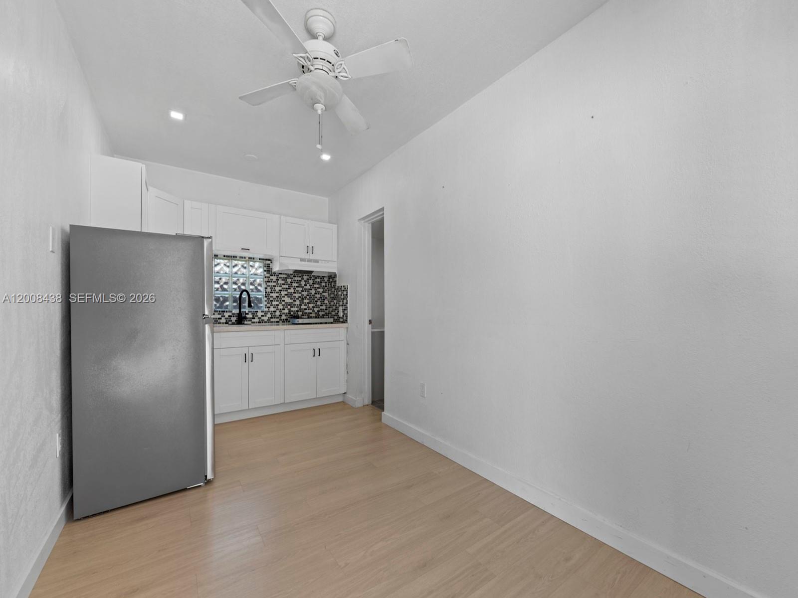 252 East 36th Street, Unit A Hialeah, FL 33013 - Photo 6 of 10 a view of an empty room with a kitchen