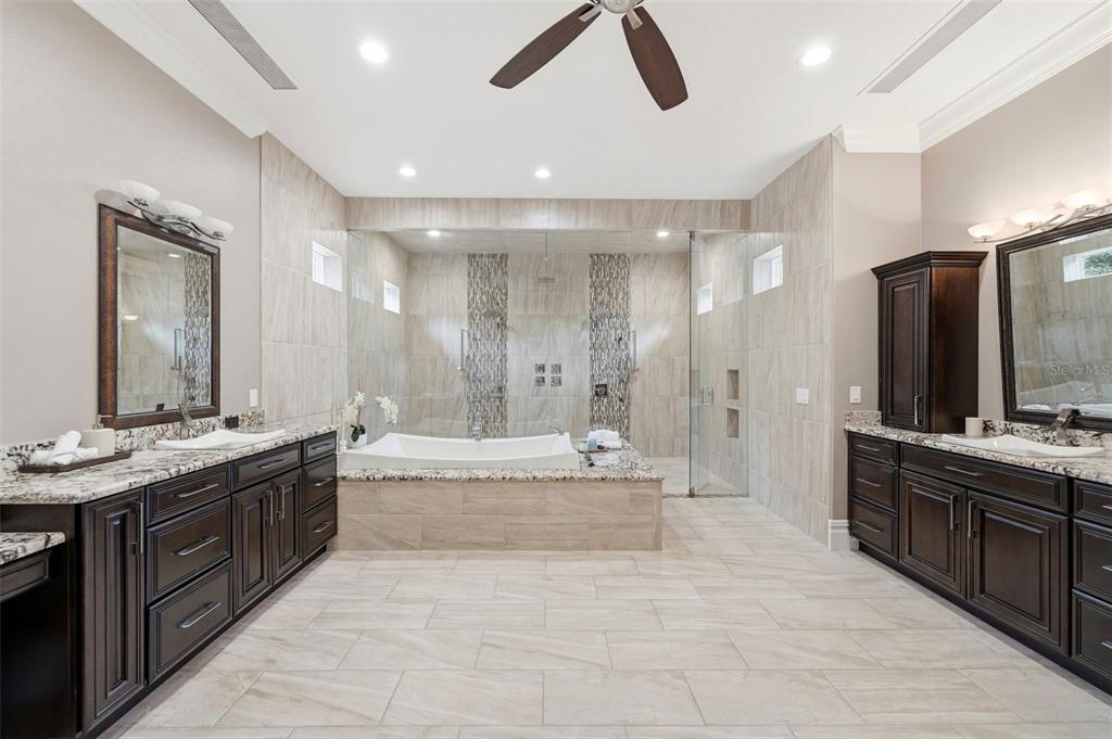 855 Southeast 87th Street Ocala, FL 34480 - Photo 50 of 79 a large bathroom with a large tub sink and double vanity