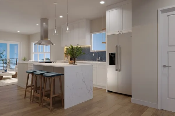 a kitchen with kitchen island granite countertop a table chairs refrigerator and microwave