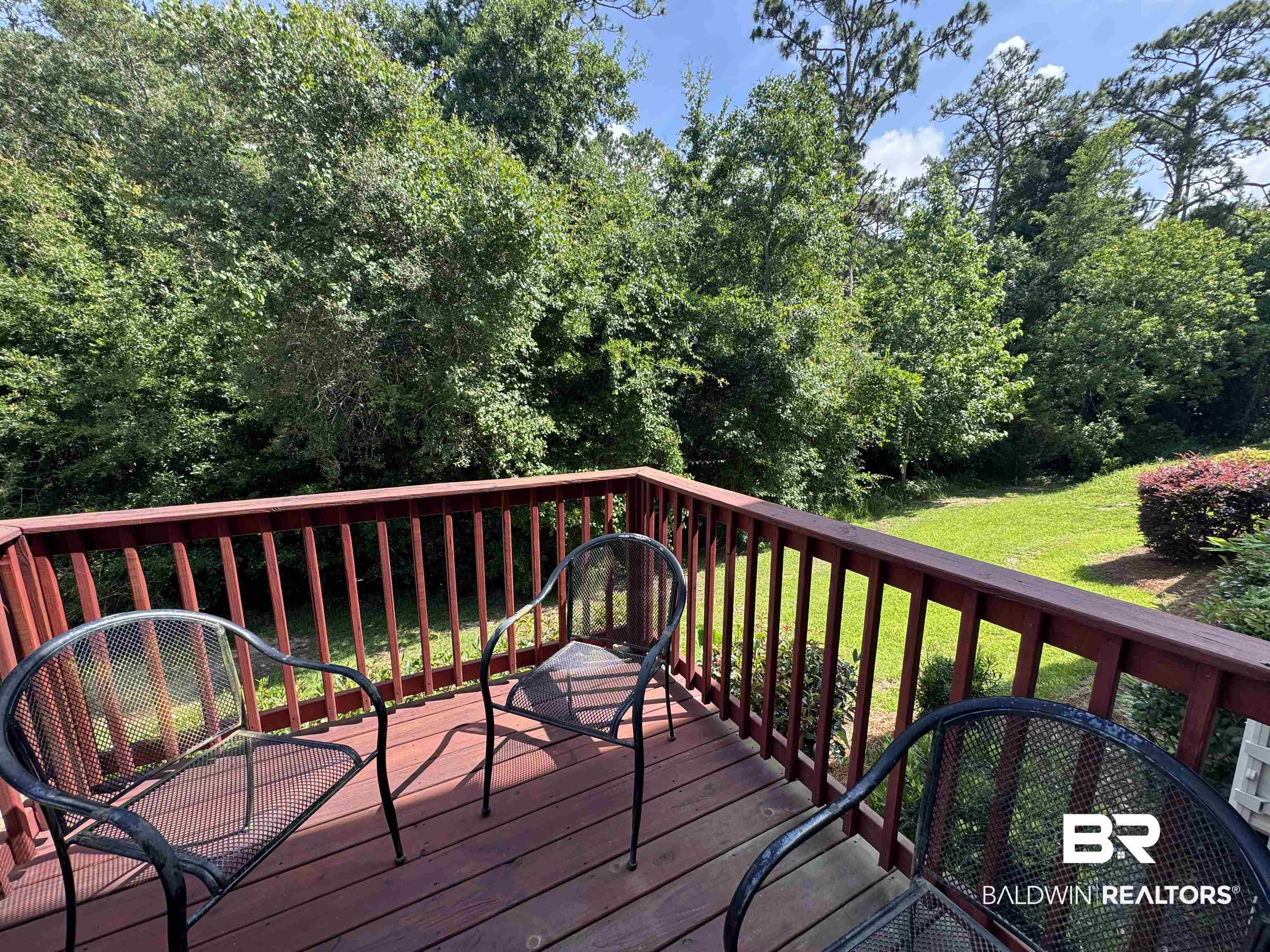 6811 Spaniel Drive, Unit C Daphne, AL 36527 - Photo 25 of 33 Wooden deck featuring a yard