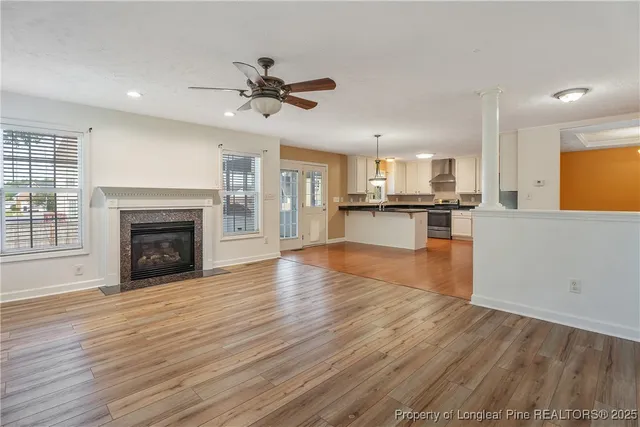 a view of a kitchen with a stove cabinets and wooden floor