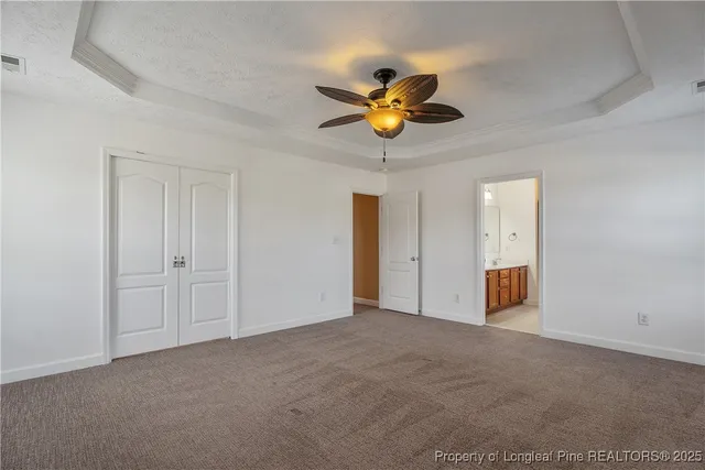 a view of an empty room and a window