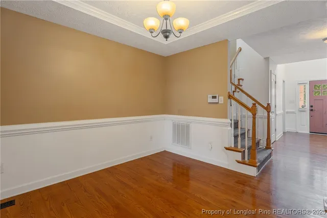 a view of an entryway with wooden floor