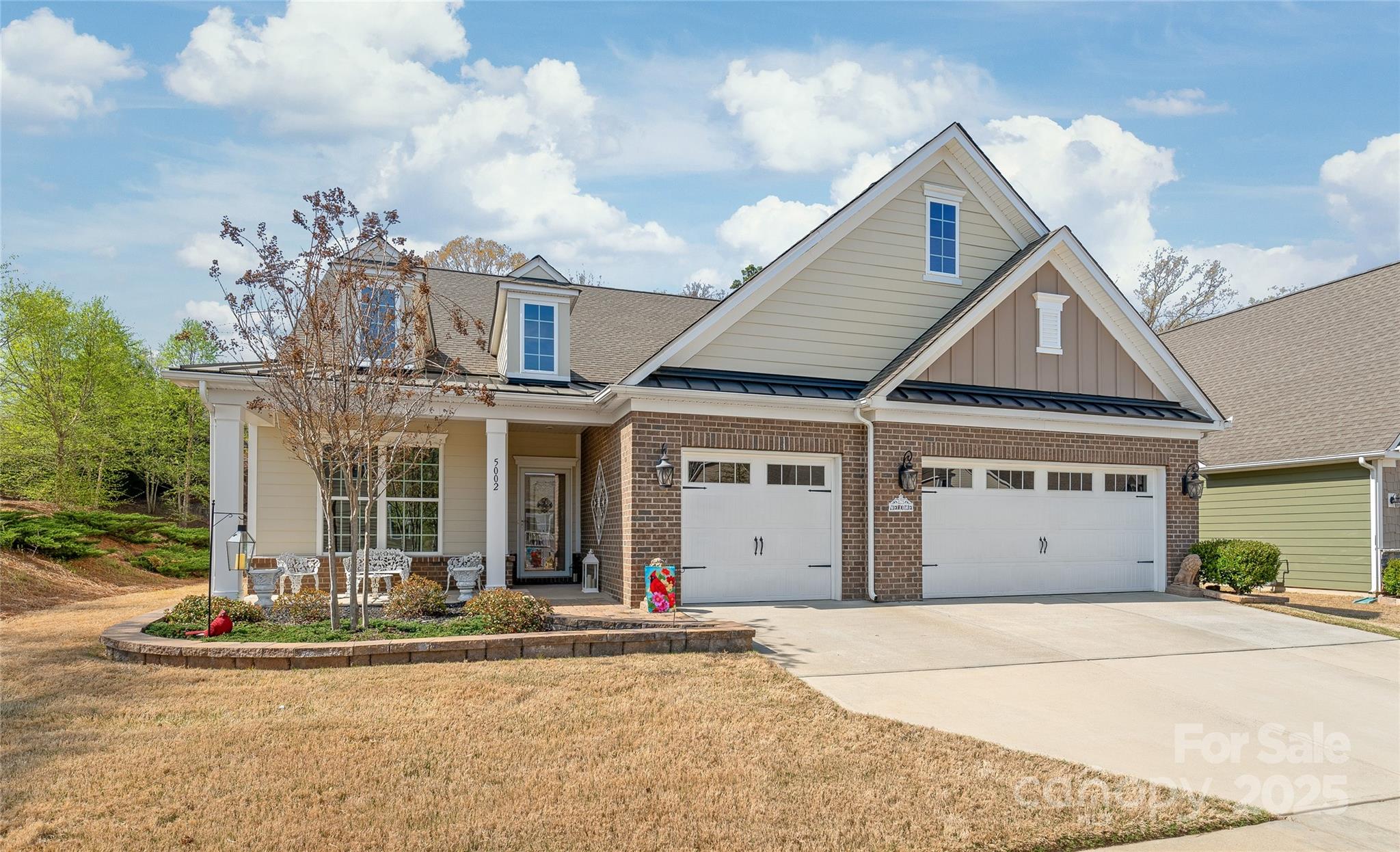 front view of a house with a garden