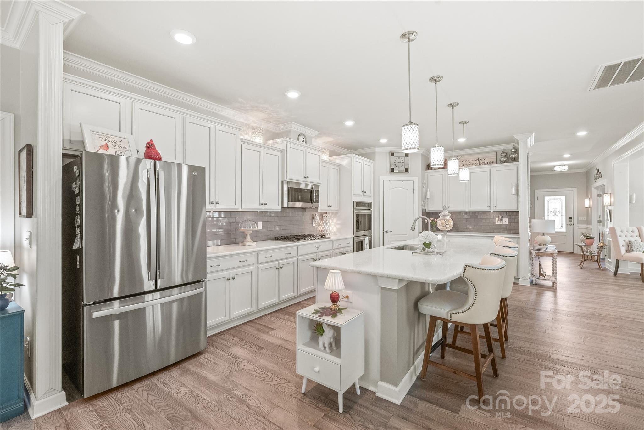 5002 Samoa Ridge Drive Lancaster, SC 29720 - Photo 11 of 45 a kitchen with kitchen island a appliances a sink a center island and furniture