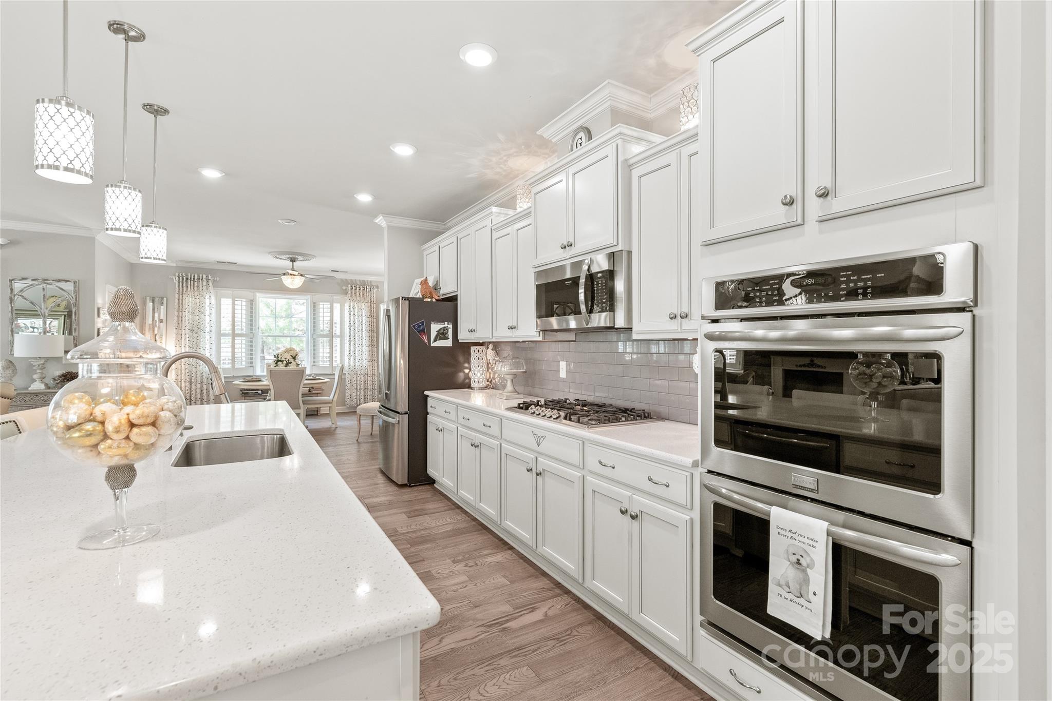 5002 Samoa Ridge Drive Lancaster, SC 29720 - Photo 12 of 45 a kitchen with stainless steel appliances granite countertop a stove top oven a sink and a refrigerator
