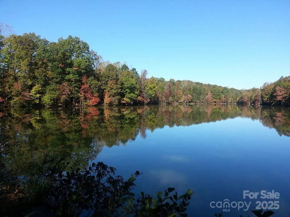 5002 Samoa Ridge Drive Lancaster, SC 29720 - Photo 39 of 45 a view of a lake with a mountain in the background