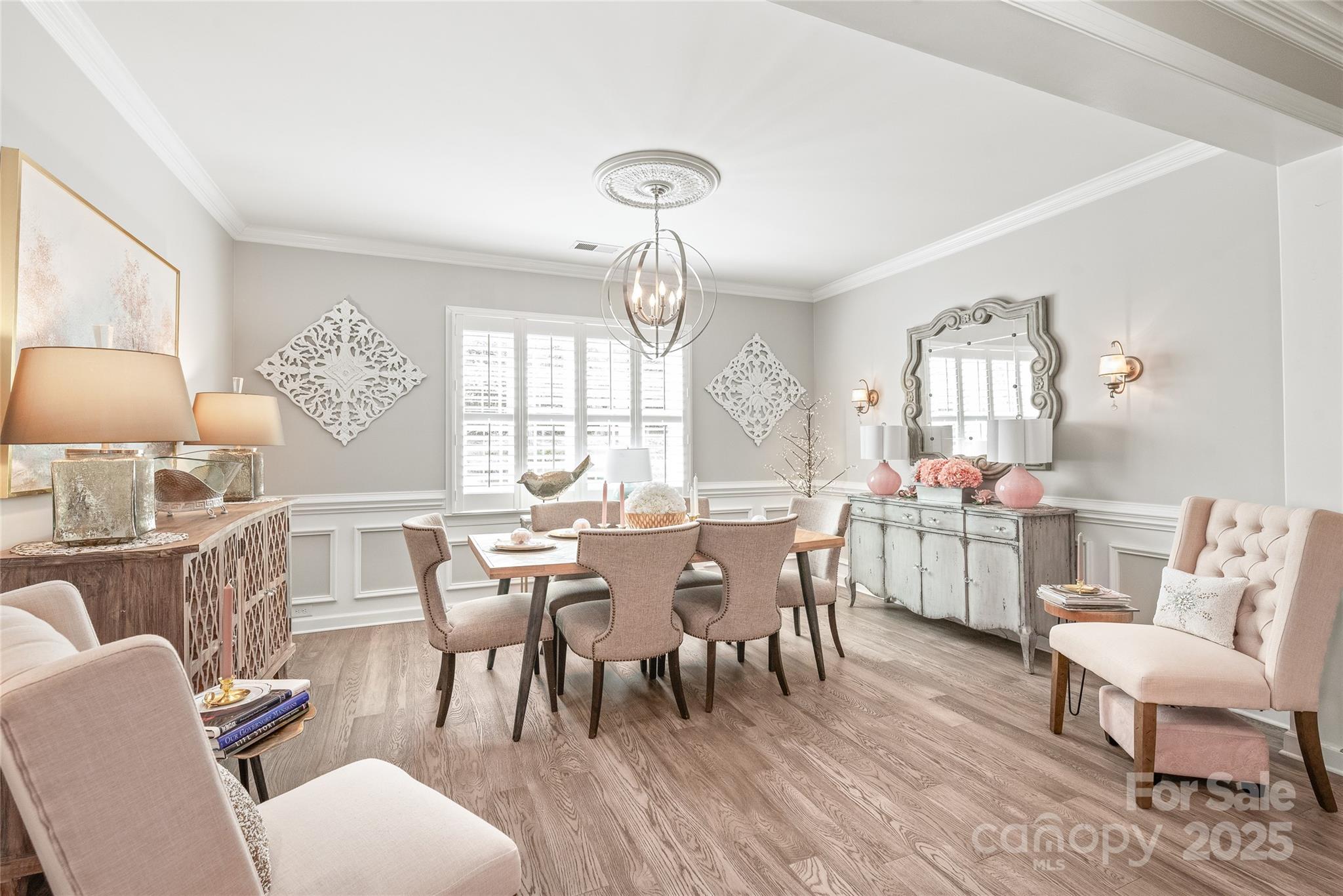 5002 Samoa Ridge Drive Lancaster, SC 29720 - Photo 6 of 45 a view of a dining room with furniture a chandelier and wooden floor