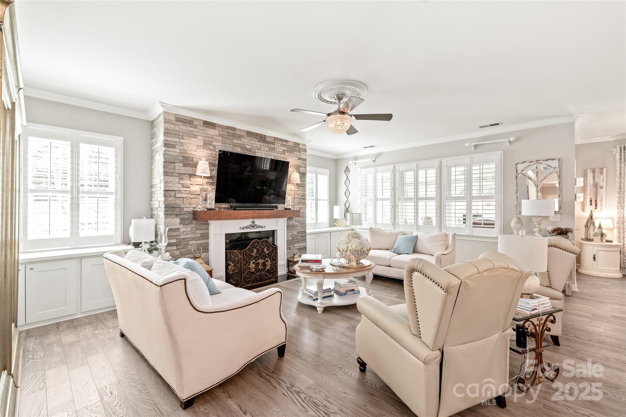 5002 Samoa Ridge Drive Lancaster, SC 29720 - Photo 7 of 45 a living room with furniture a fireplace and a flat screen tv