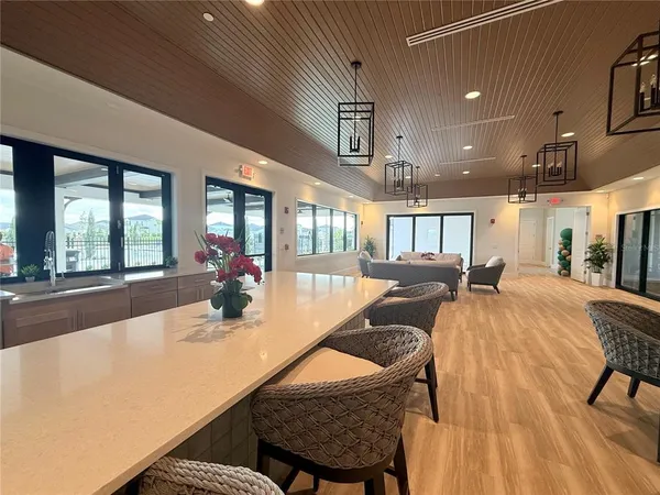 a view of a livingroom with furniture and a flat screen tv