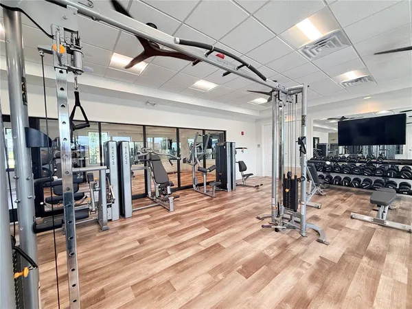 a view of a lake with a garden and sitting area