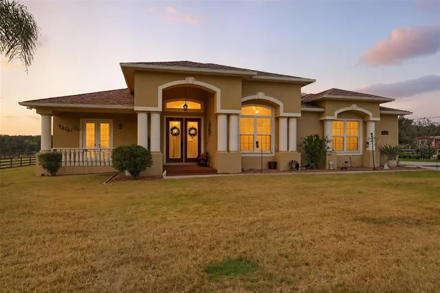 a hallway with a bed and a window