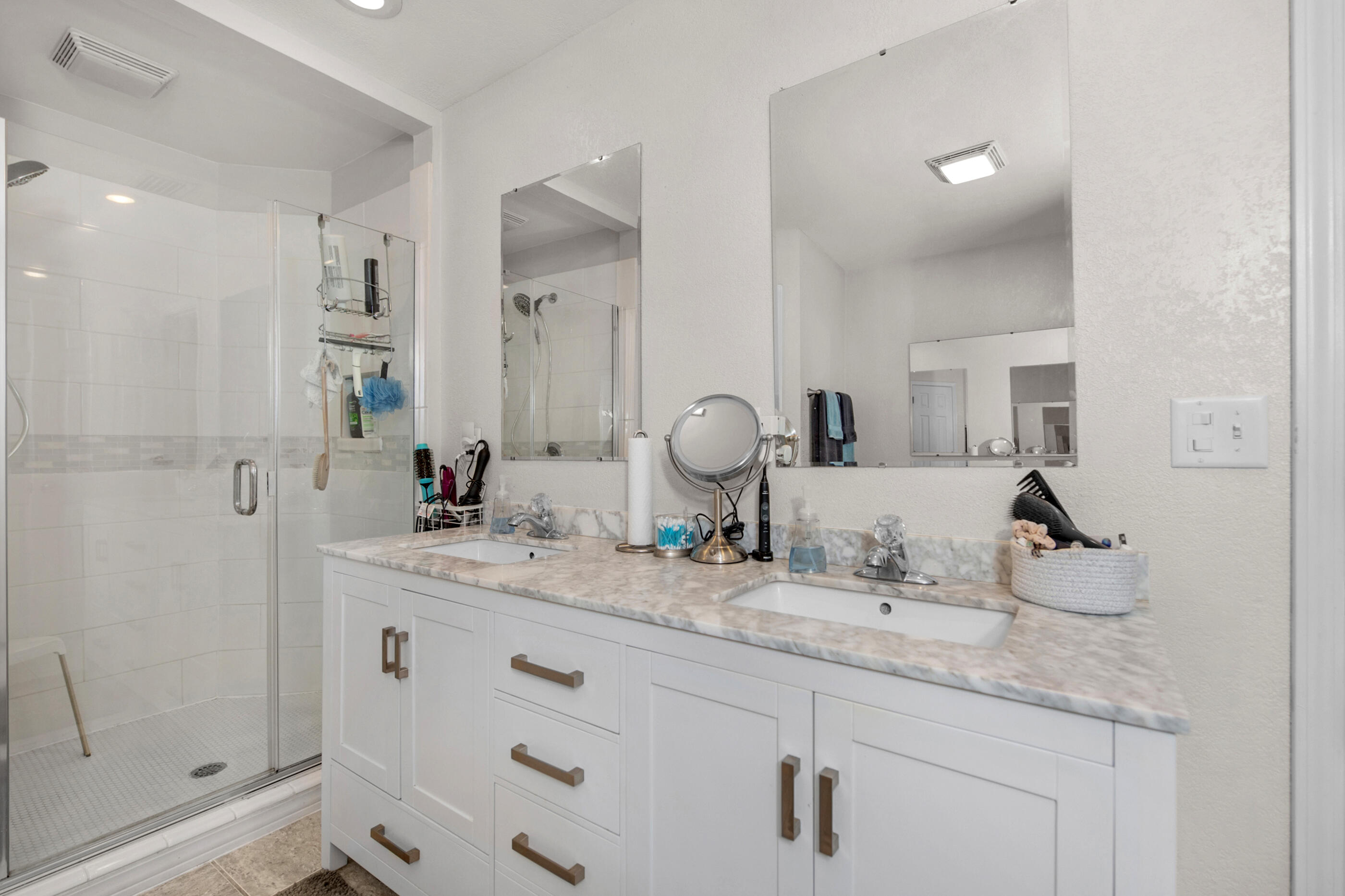 1984 Pine Ranch Drive Navarre, FL 32566 - Photo 18 of 45 a bathroom with double sink and a mirror