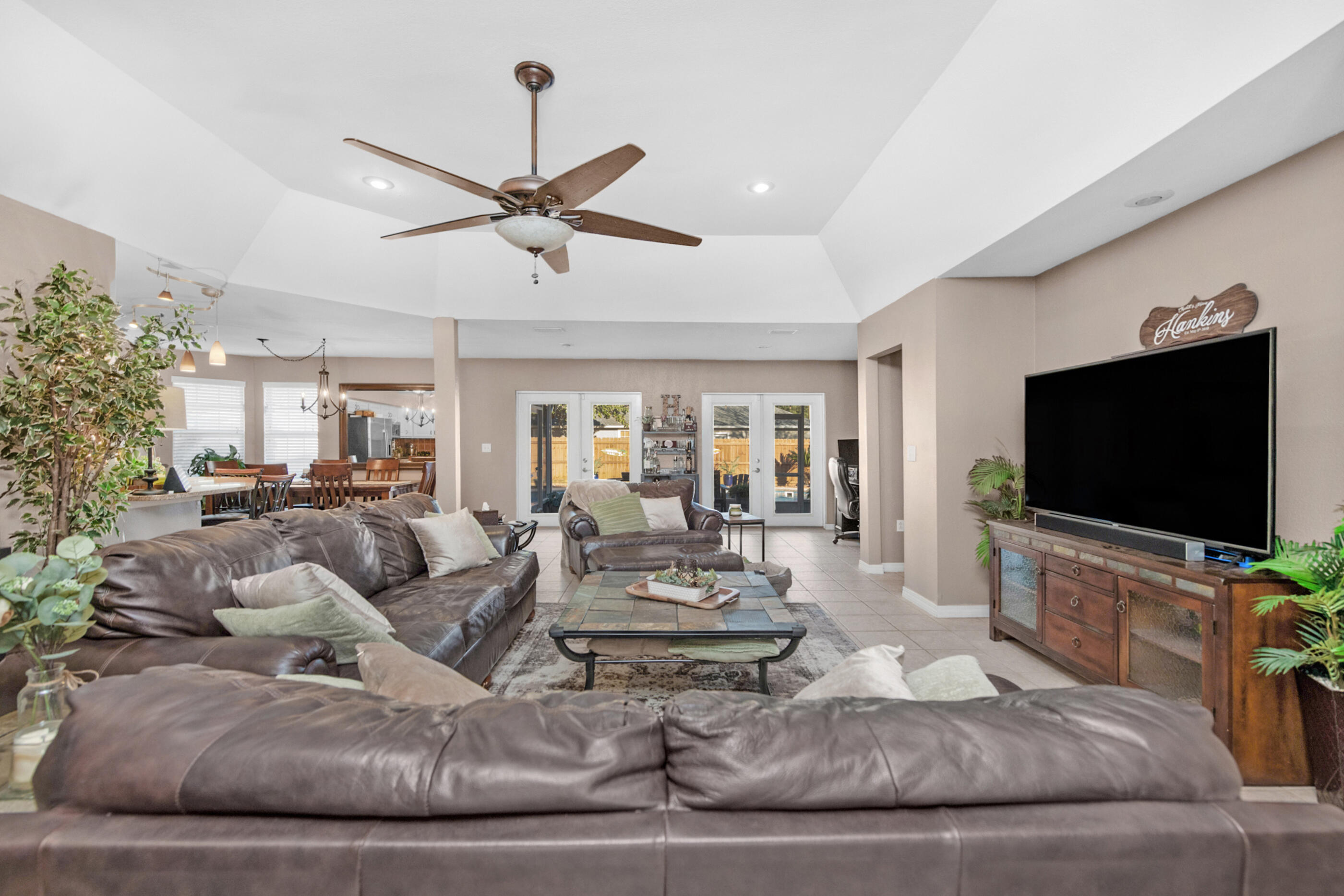 1984 Pine Ranch Drive Navarre, FL 32566 - Photo 2 of 45 a living room with furniture and a flat screen tv