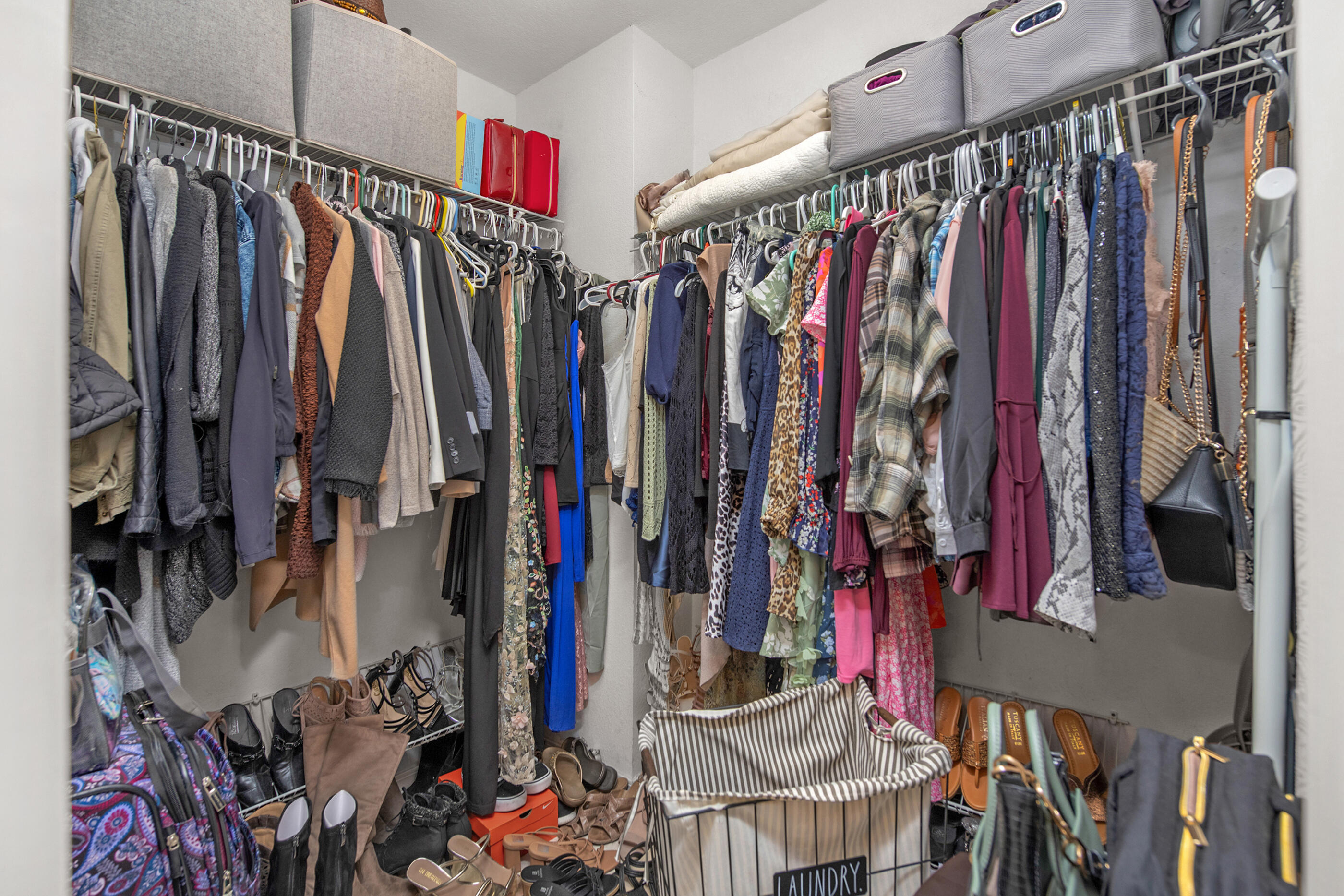 1984 Pine Ranch Drive Navarre, FL 32566 - Photo 21 of 45 a view of walk in closet with clothes