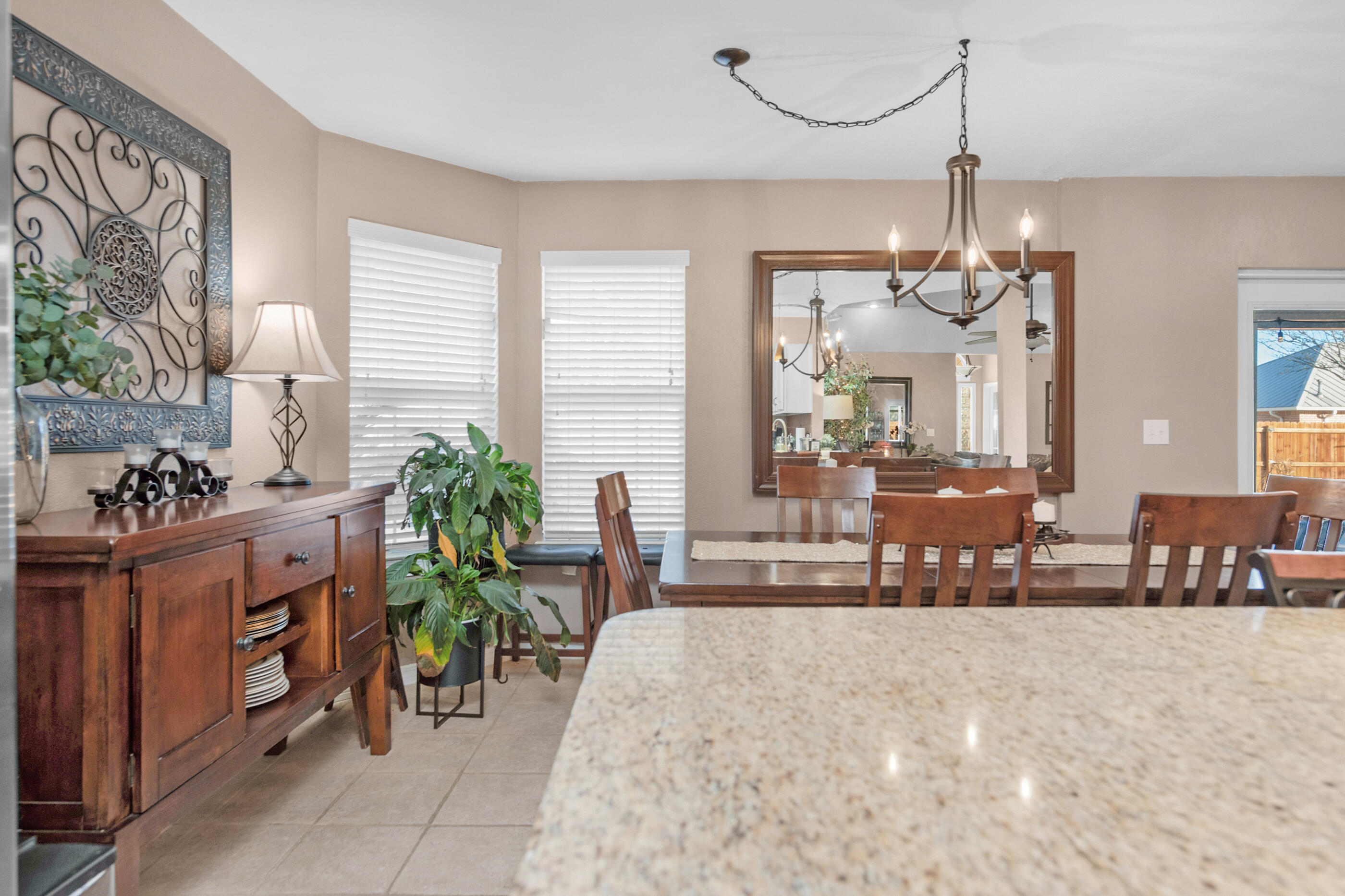 1984 Pine Ranch Drive Navarre, FL 32566 - Photo 28 of 45 a view of a dining room with furniture and a chandelier