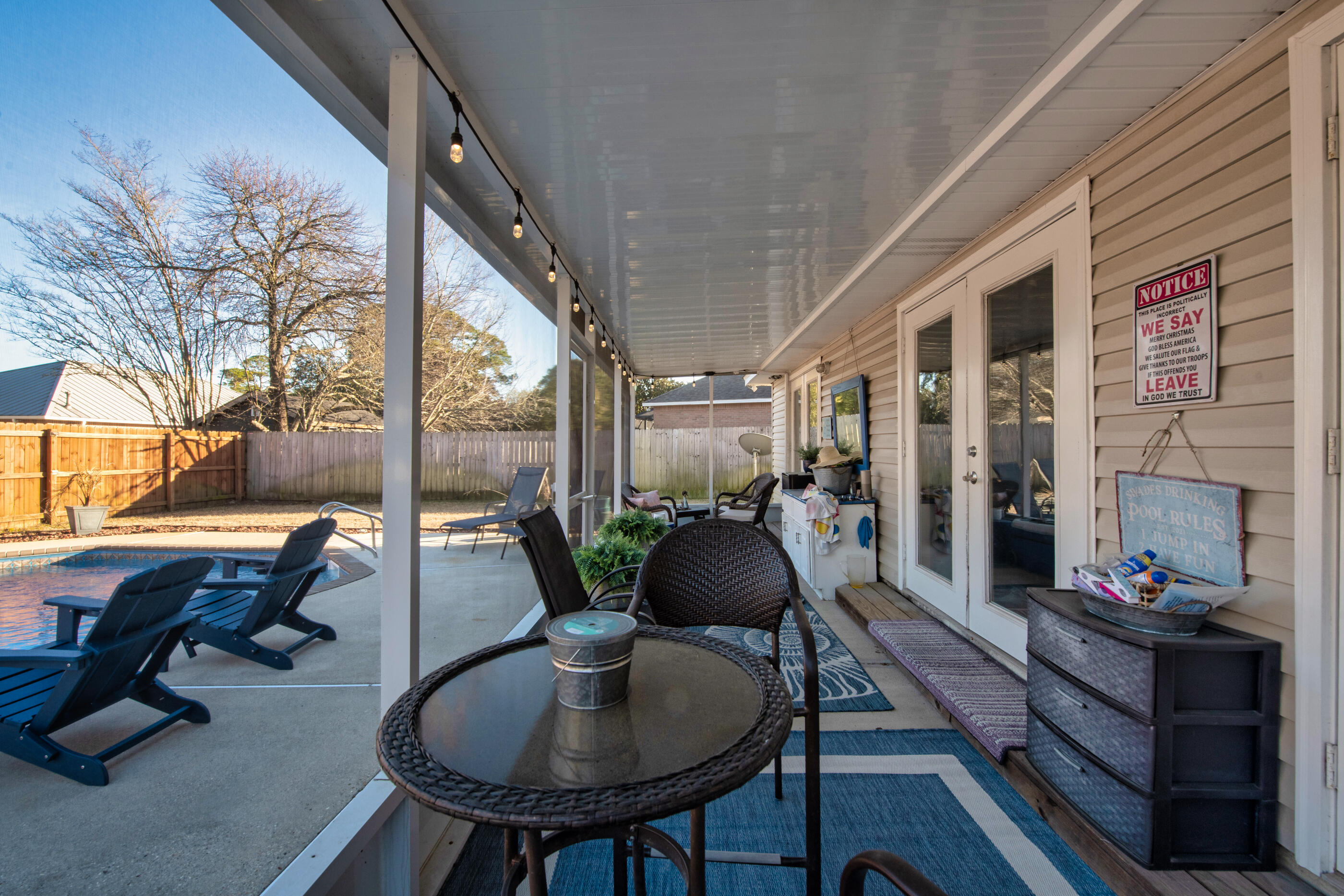 1984 Pine Ranch Drive Navarre, FL 32566 - Photo 29 of 45 a living room with furniture and a potted plant