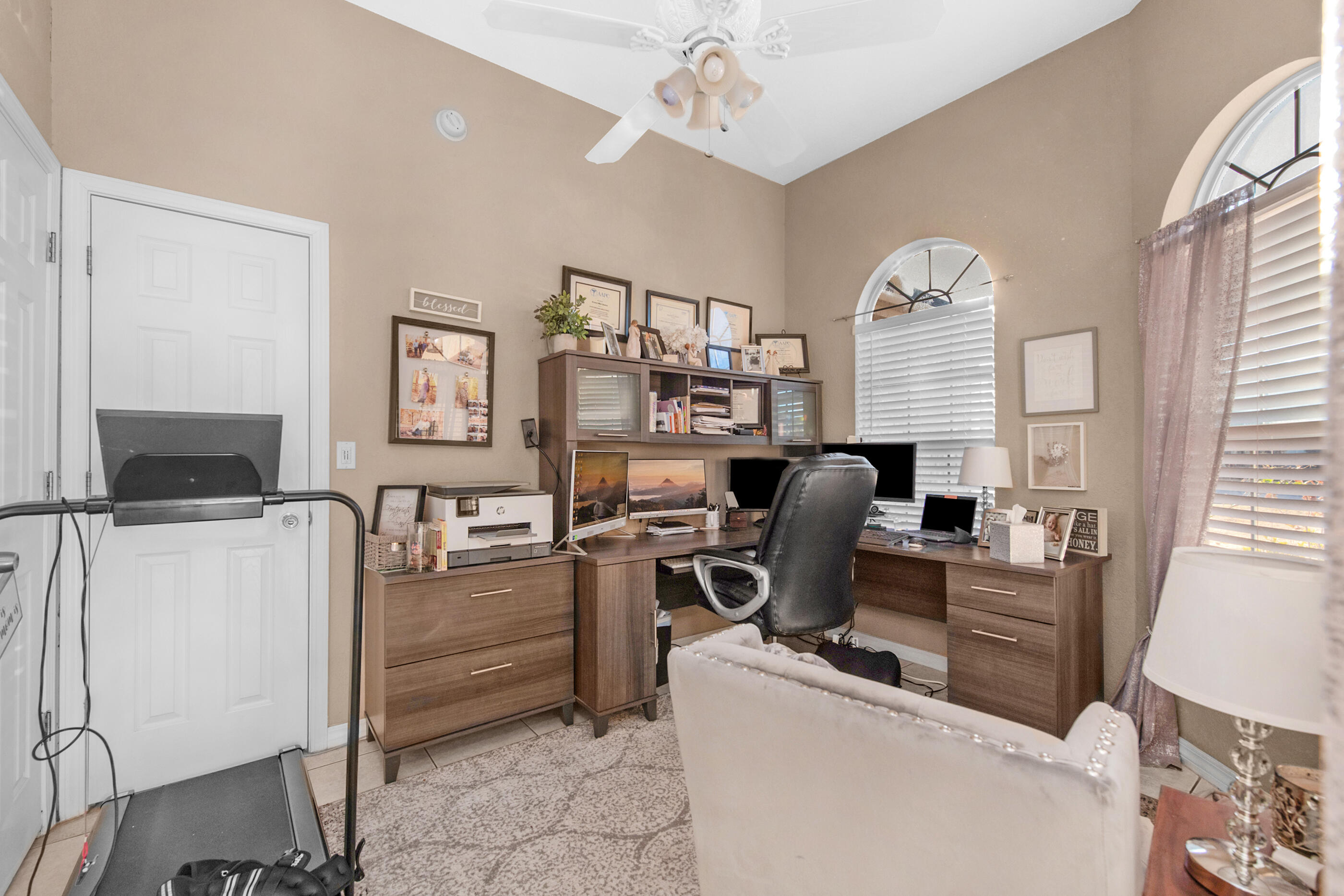 1984 Pine Ranch Drive Navarre, FL 32566 - Photo 8 of 45 a work room with furniture and a flat screen tv