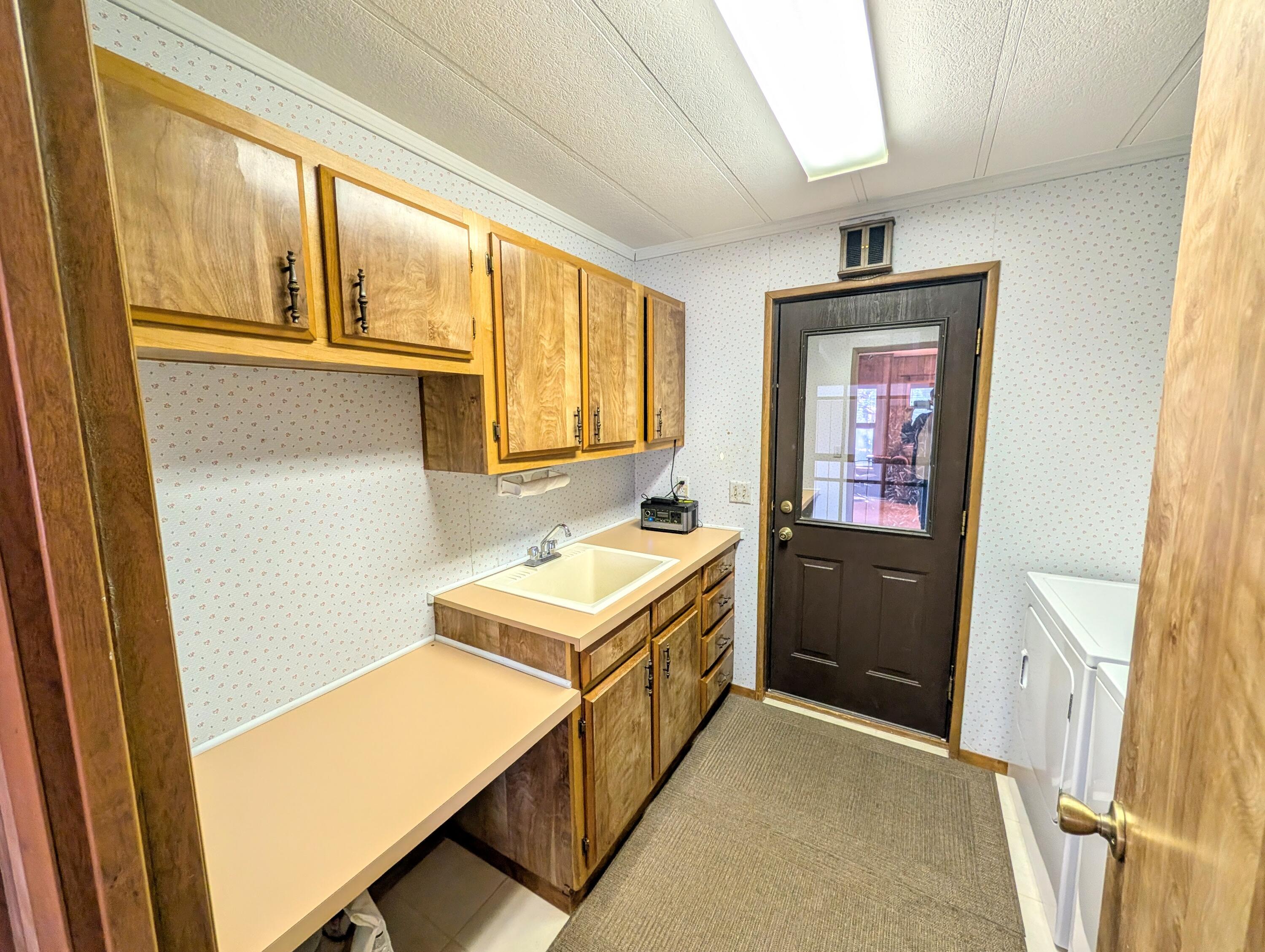 20735 Valentine Street, Unit 6 Bend, OR 97701 - Photo 12 of 26 a bathroom with a sink a mirror and a bathtub