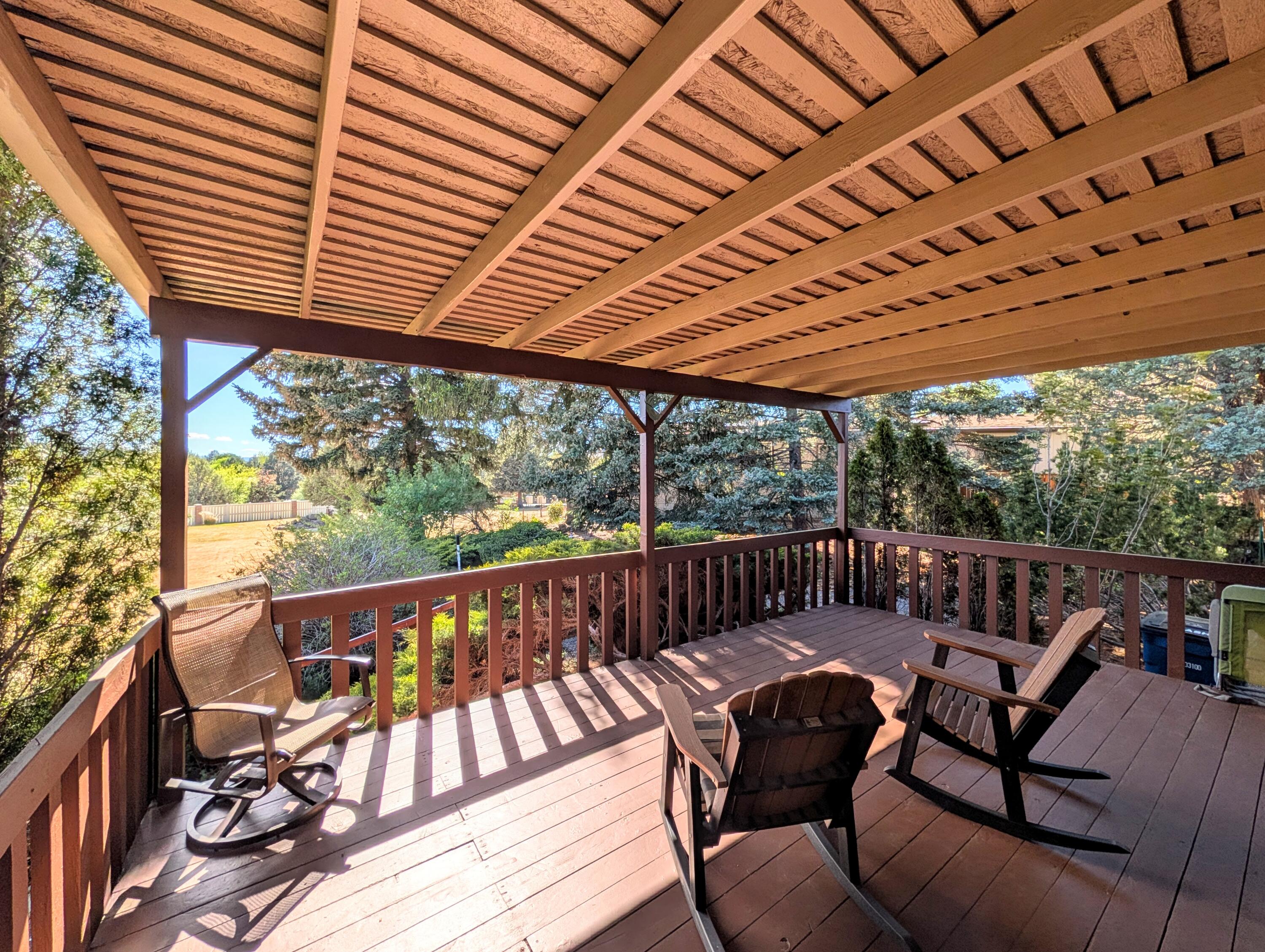 20735 Valentine Street, Unit 6 Bend, OR 97701 - Photo 21 of 26 a view of a chairs in wooden deck