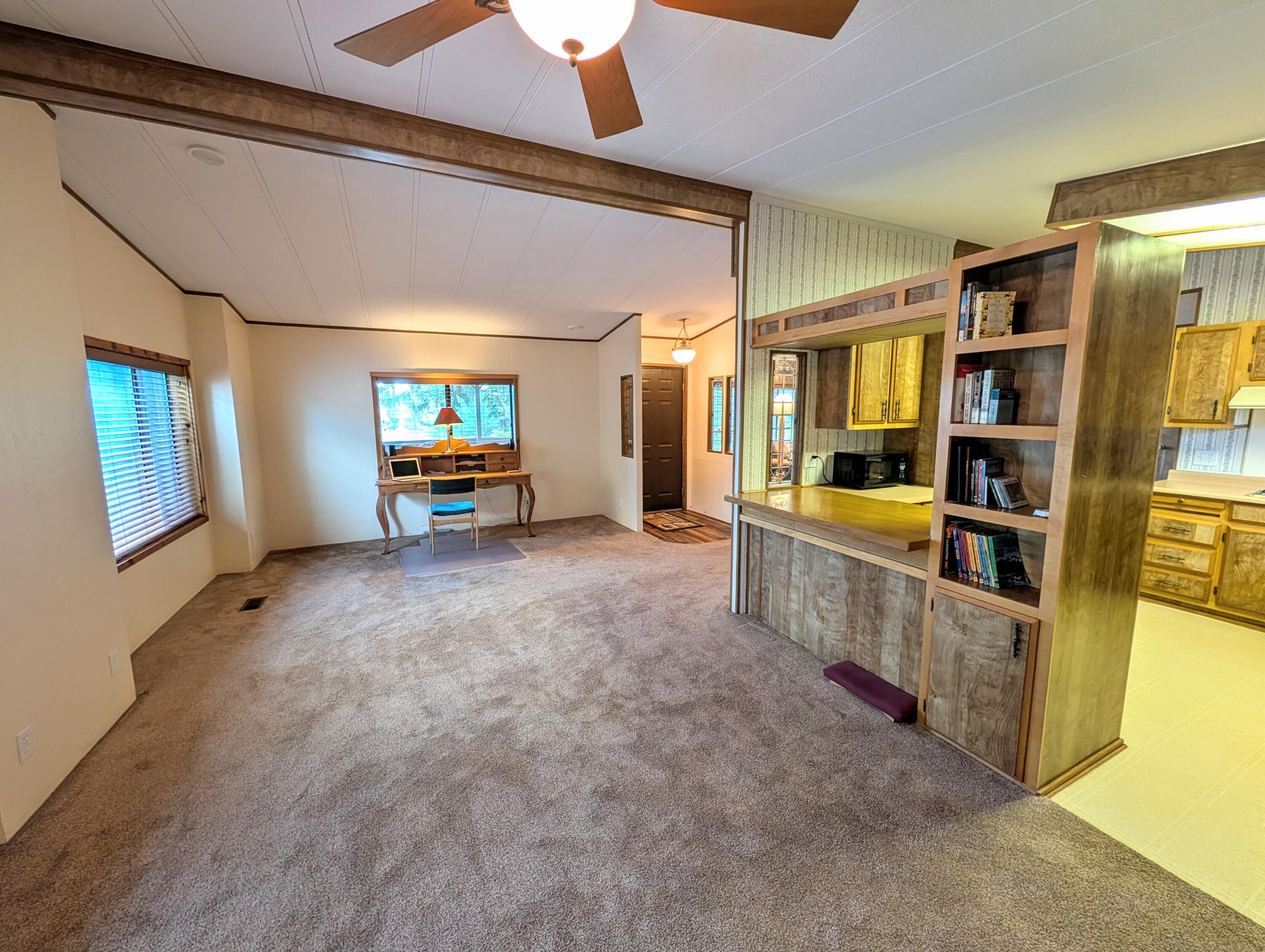 20735 Valentine Street, Unit 6 Bend, OR 97701 - Photo 10 of 26 a large room with lots of wooden furniture and windows