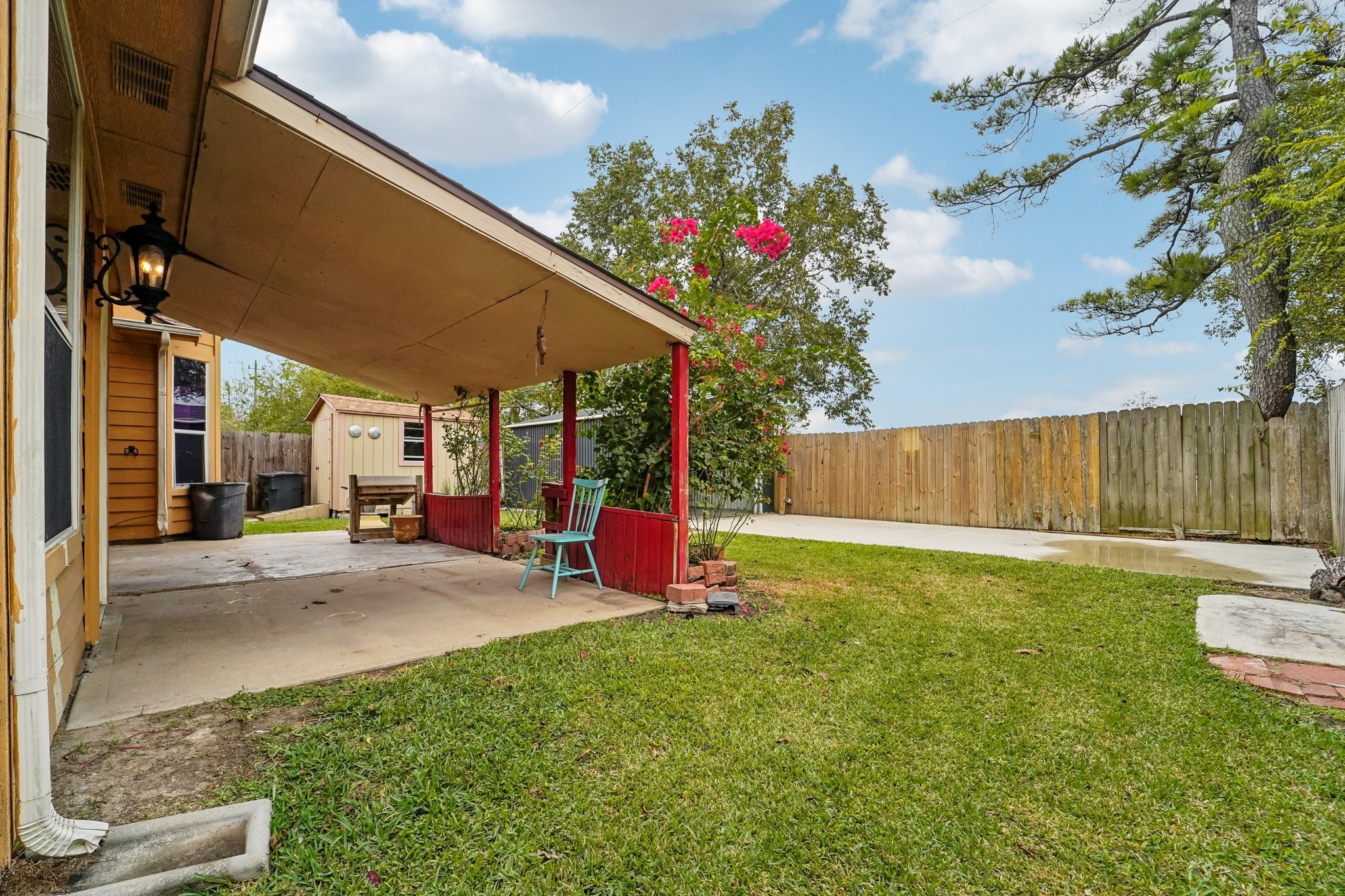 3818 Ridge Canyon Road Baytown, TX 77521 - Photo 27 of 32 a view of a backyard with sitting area
