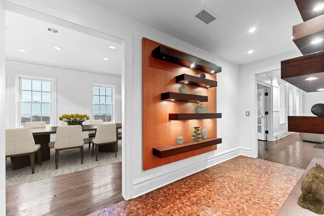 a large kitchen with a table and chairs