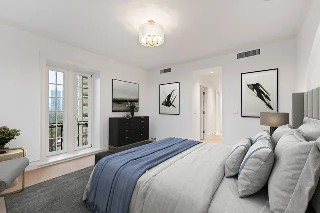 a room with kitchen island a sink and a large window