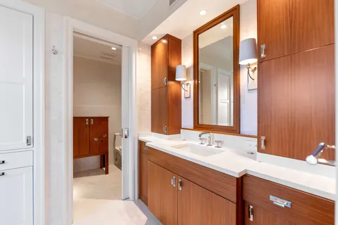 a bedroom with a bed couch and a window