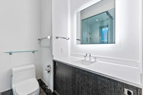 a utility room with a sink and a microwave