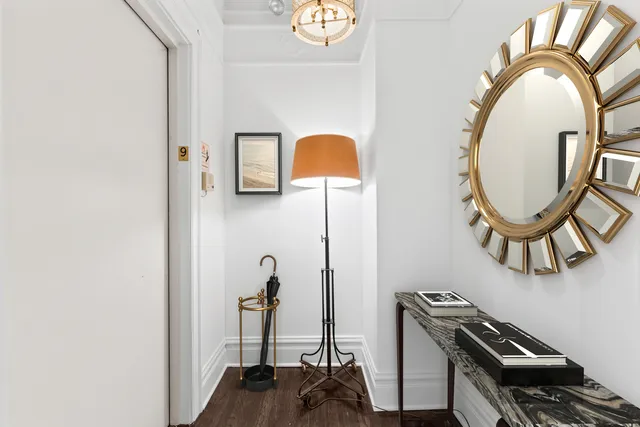 a living room with fireplace furniture and a wooden floor