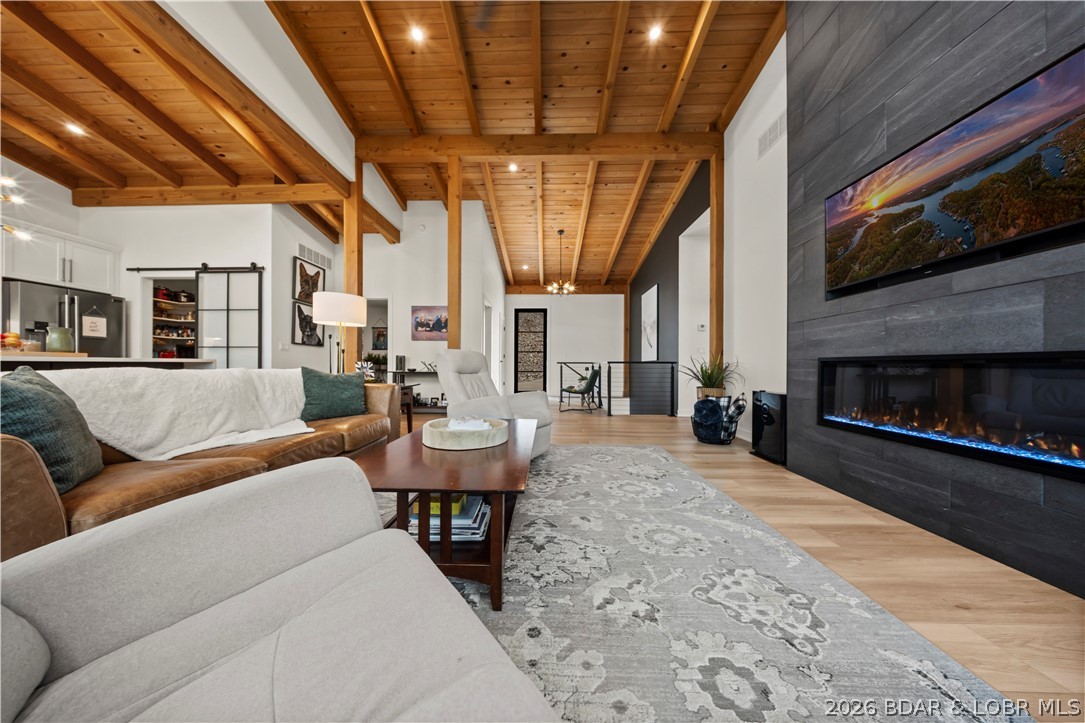 1151 Oak Road Osage Beach, MO 65065 - Photo 11 of 63 Open living room with custom wood ceilings, design