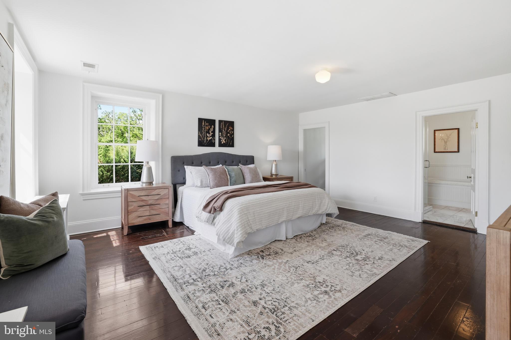 17781 Roxbury Hall Road Leesburg, VA 20175 - Photo 42 of 107 a bedroom with a large bed and a couch