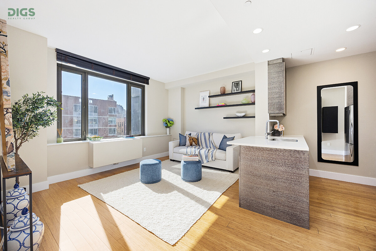 305 West 16th Street, Unit 5F Manhattan, NY 10011 - Photo 1 of 13 a living room with furniture and a large window